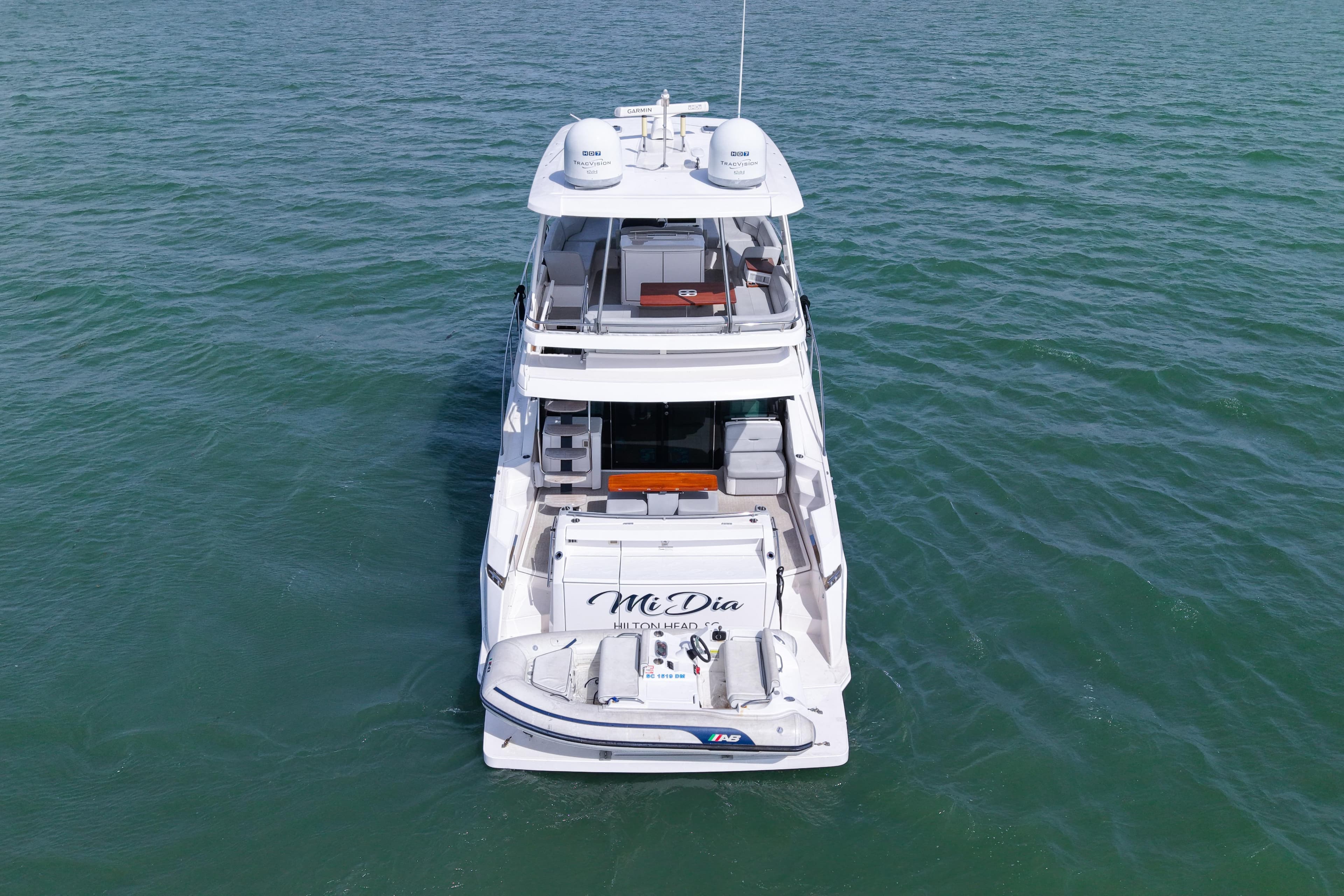 2019 Tiara Yachts F53 Flybridge on open water, rear view.