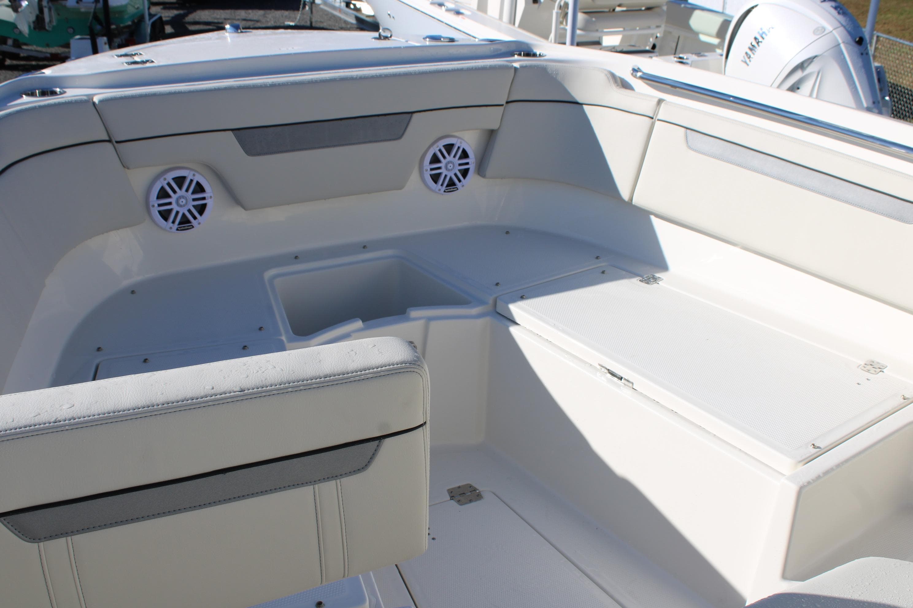 Interior of 2026 Sailfish 252 CC boat, featuring seating and storage compartments.