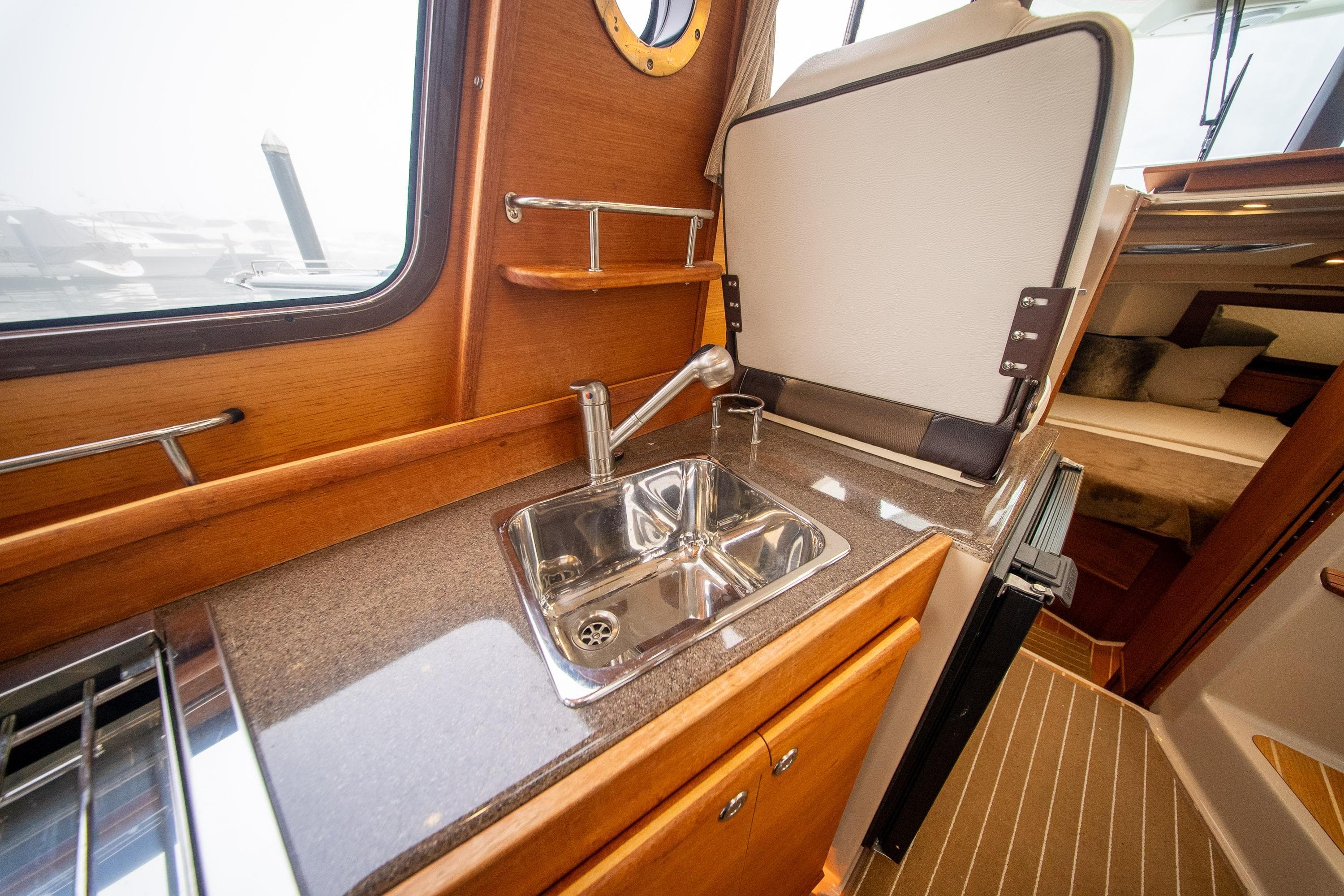 2016 Ranger Tugs R-29 interior kitchen with sink and countertop.