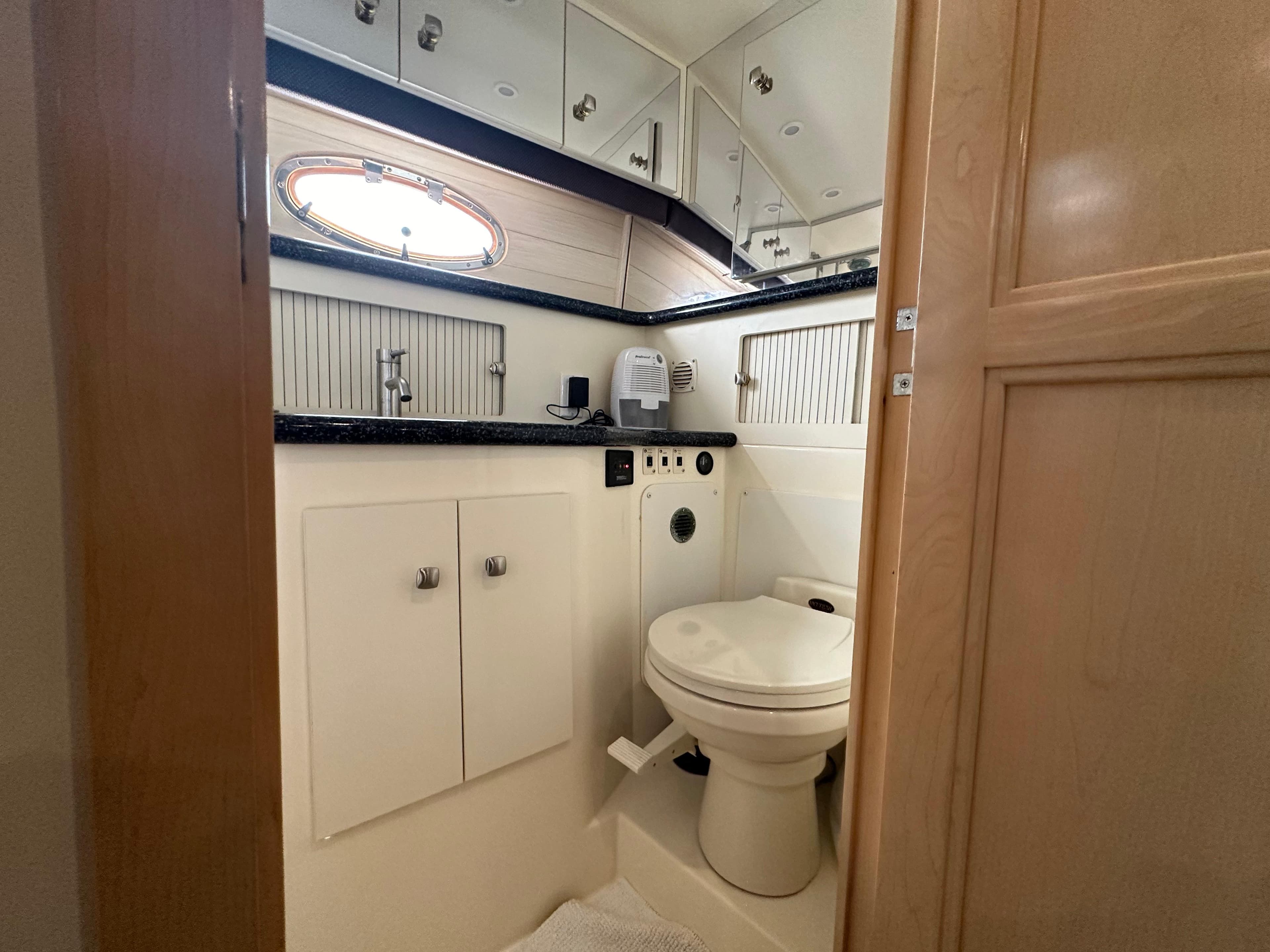 Bathroom interior of a 2000 Carver 406 Motor Yacht with modern fixtures.