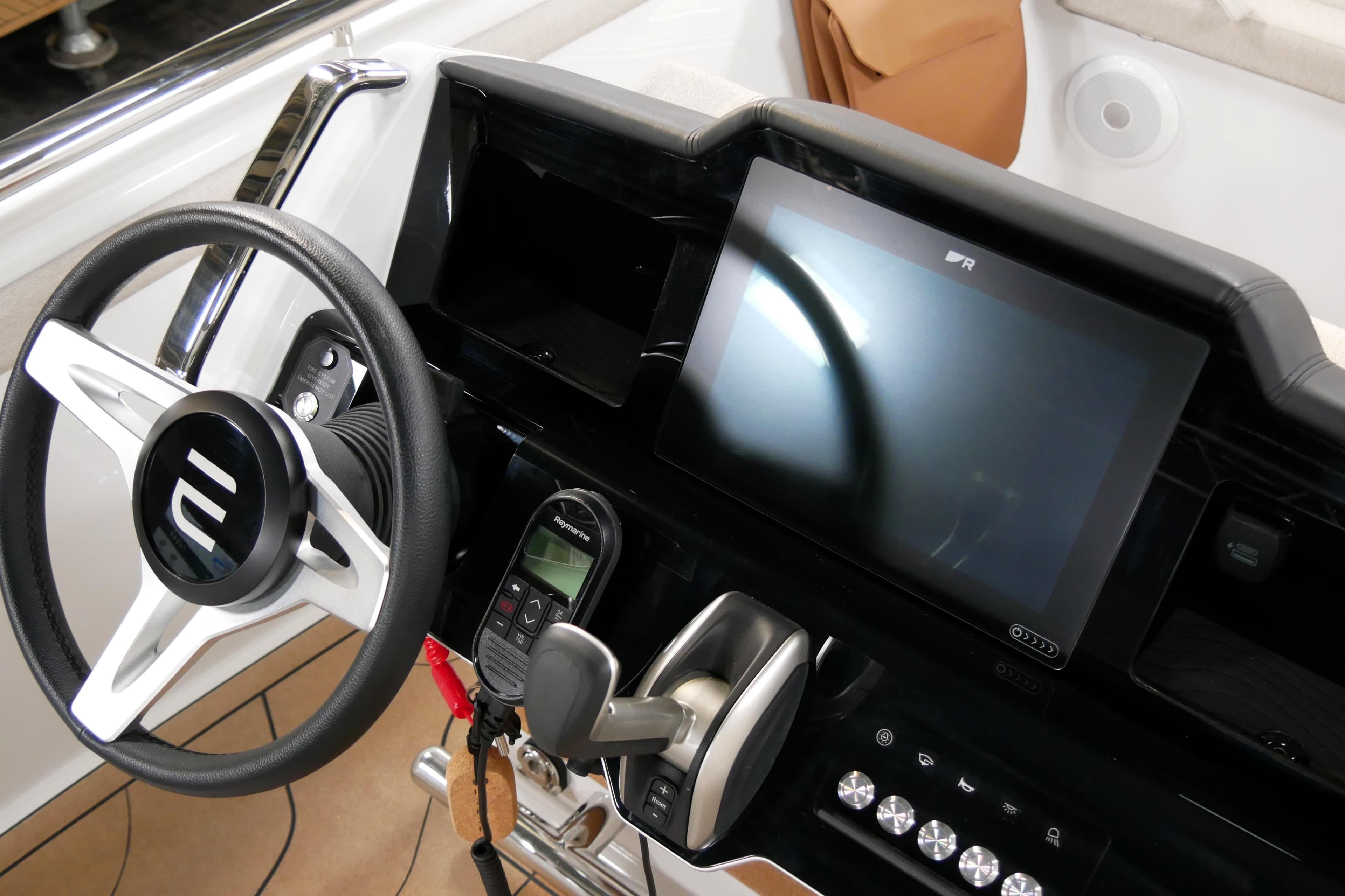 Steering console of 2026 Evene Origin 57 with touchscreen and controls.