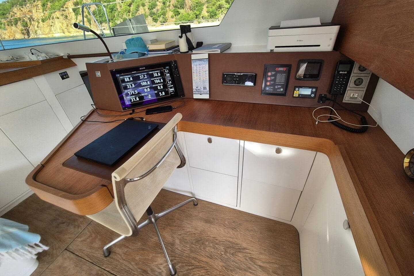 Modern yacht navigation station with electronic equipment, Alibi 54, 2016 model.