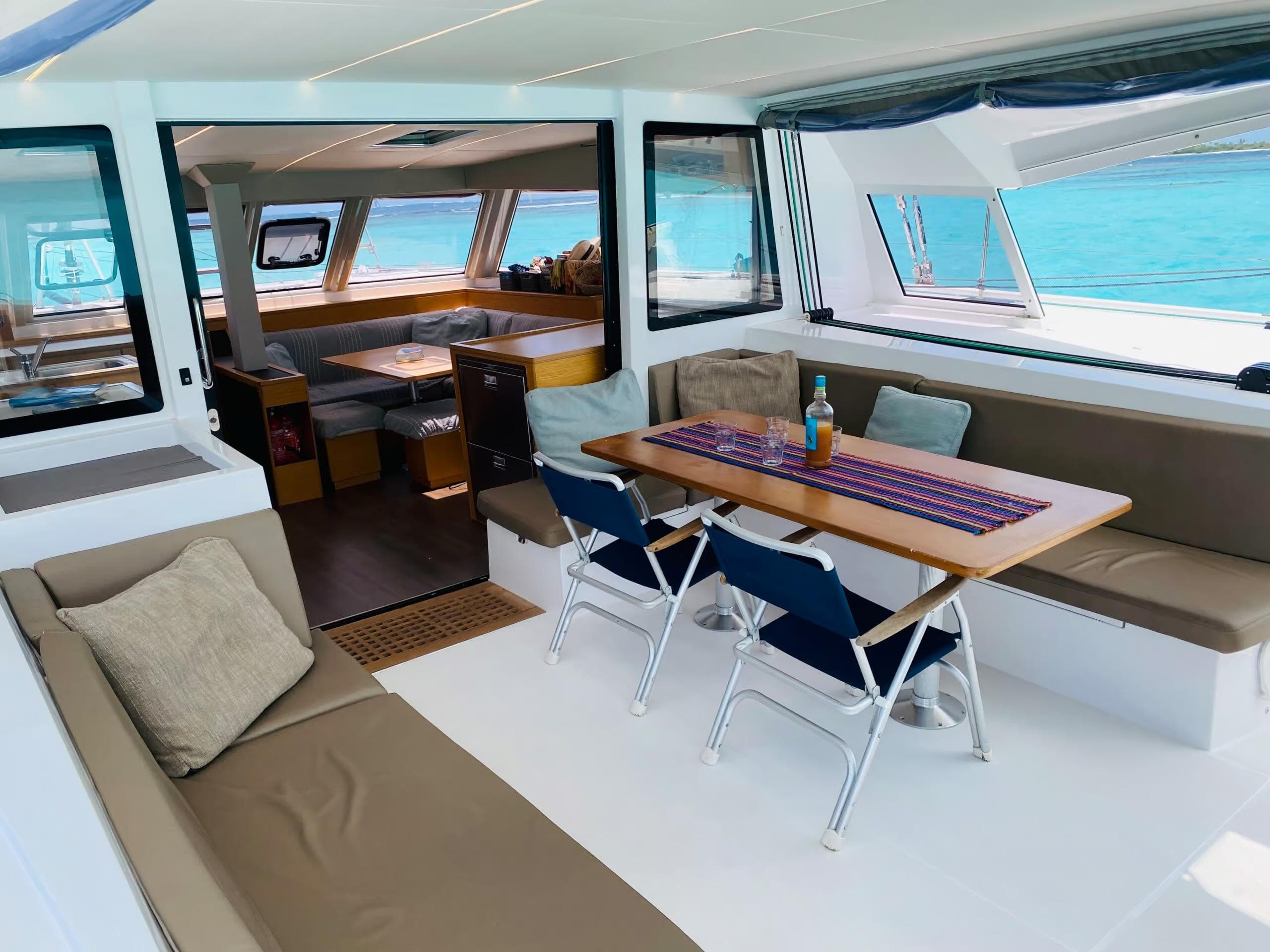 Luxurious interior of 2018 Nautitech 46 Open catamaran with spacious seating and dining area.