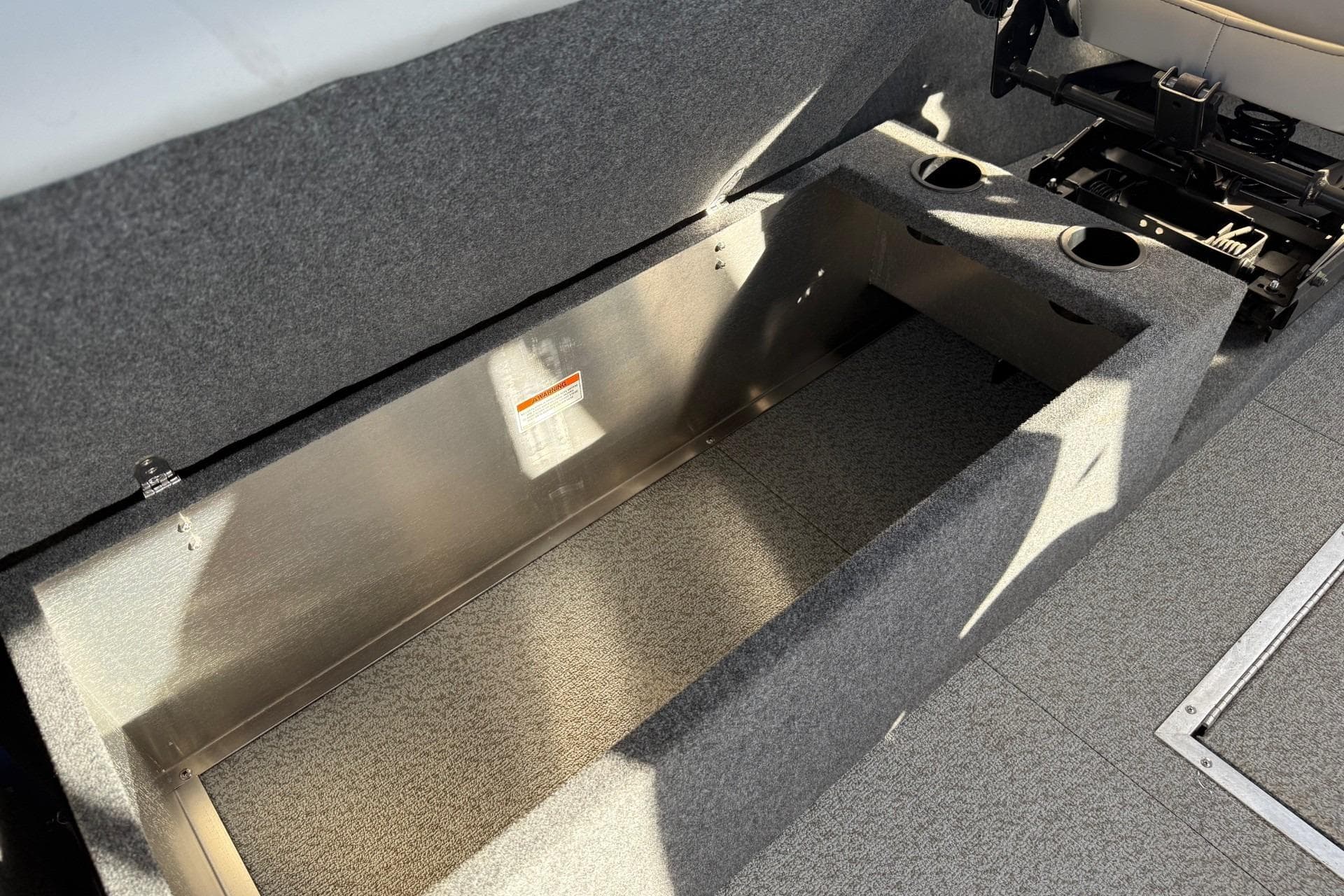 2025 Thunder Jet 24 Alexis Pro boat interior storage compartment with cup holders.