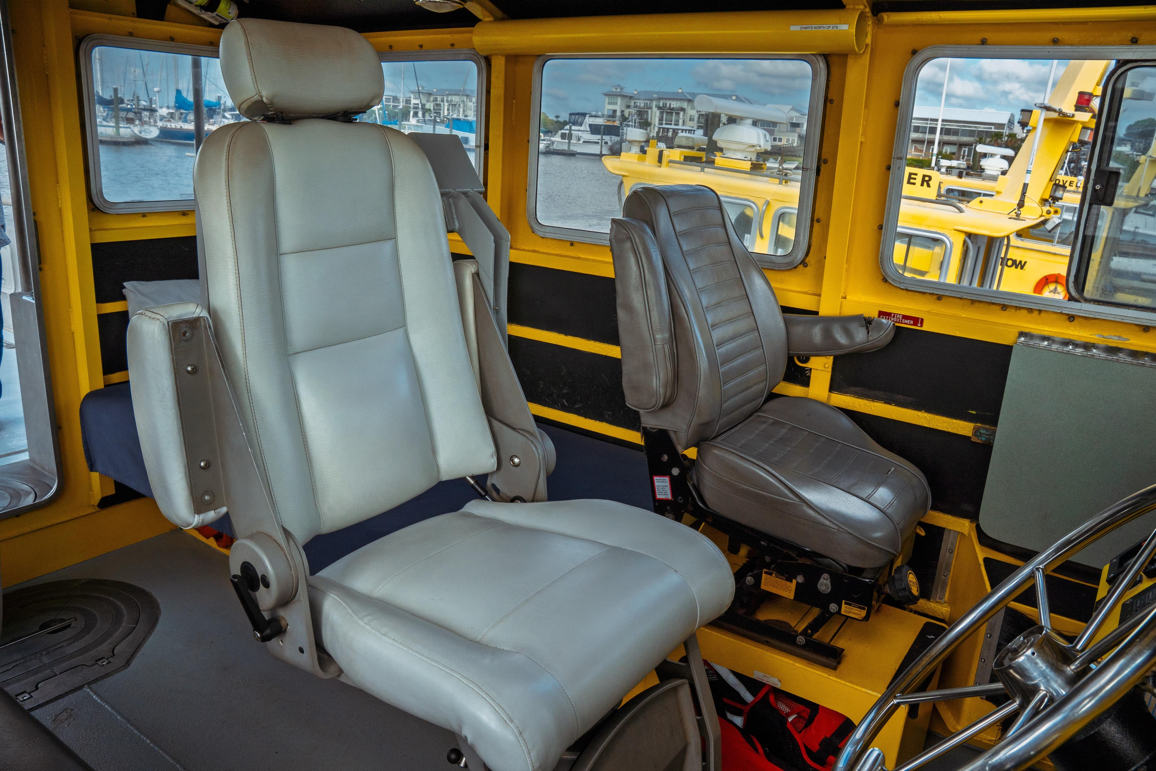 Interior of a 2004 Kvichak Marine Industries Pilot boat, featuring two captain's chairs.