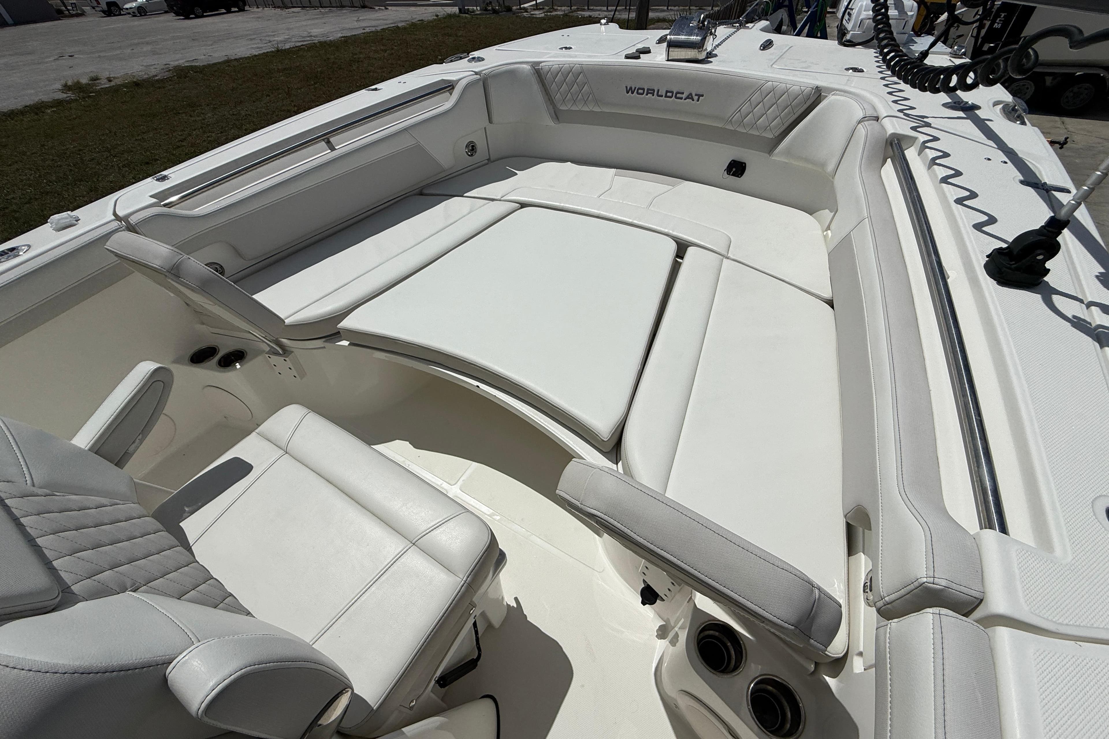 2024 World Cat 295 CC boat interior with white seating and modern design.