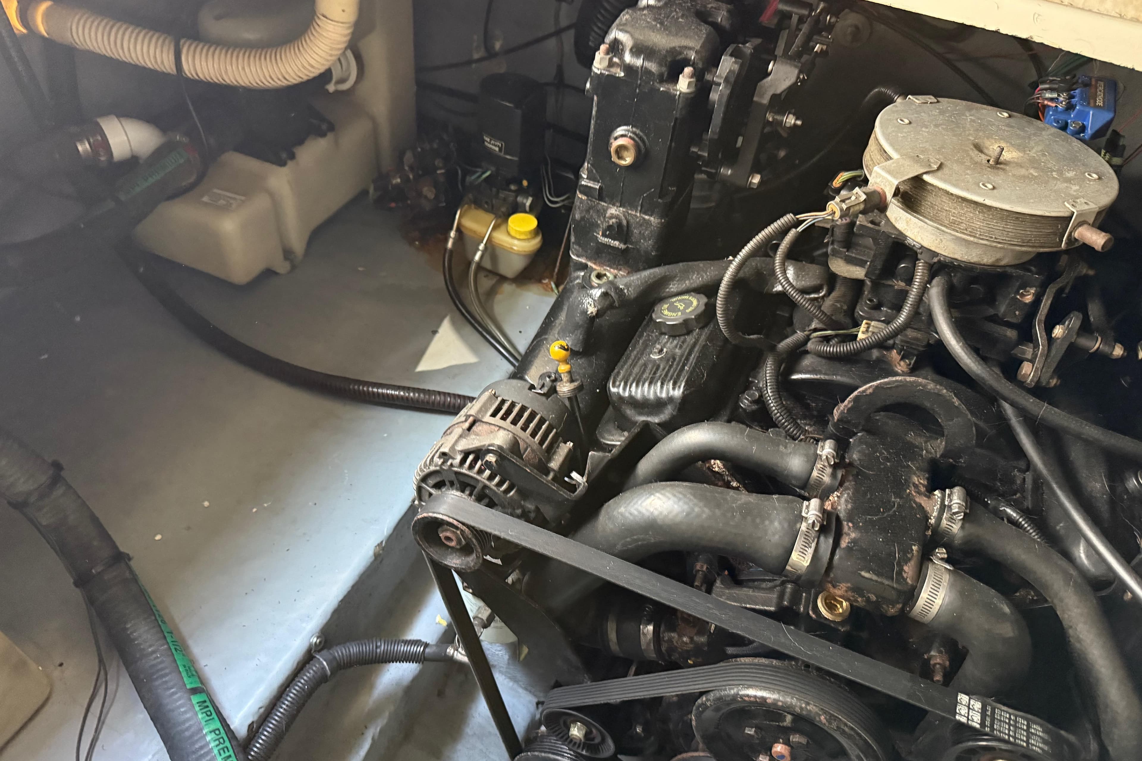 Engine compartment of a 2001 Sea Ray 260 Sundancer boat, showing mechanical components.