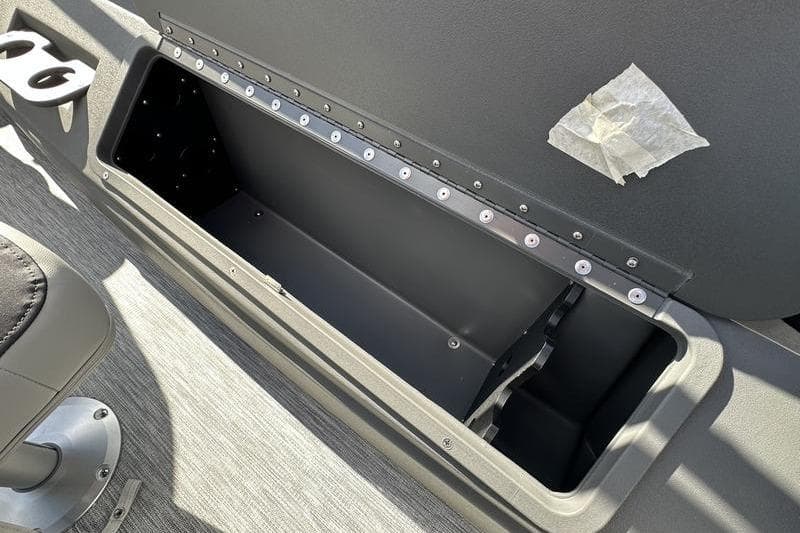 Open storage compartment in 2026 Bennington S 20 SF boat interior.