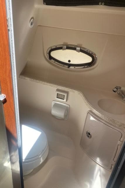 2006 Regal 2860 Window Express boat bathroom with toilet and sink.