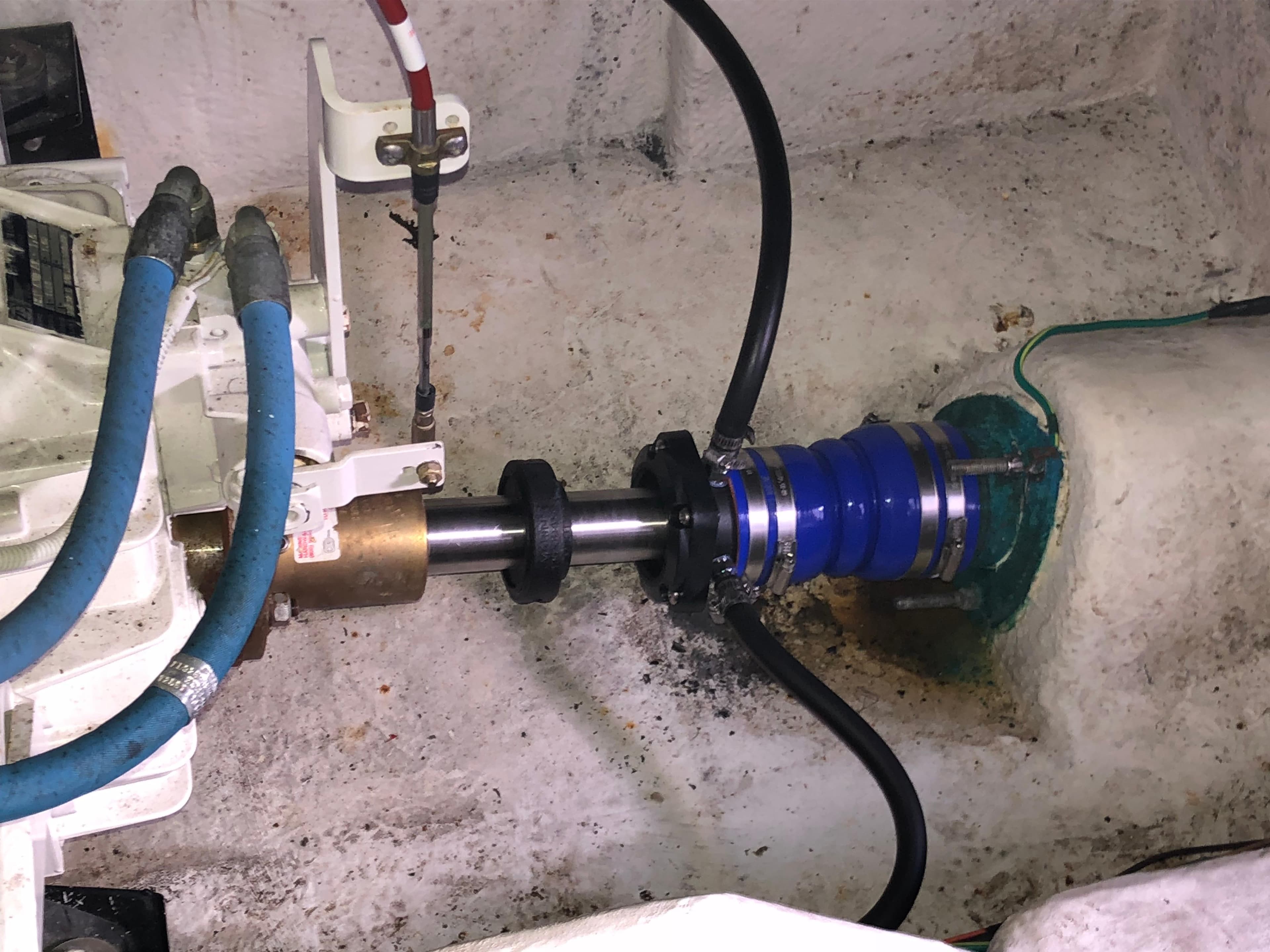 Bayliner 39 Motor Yacht 2002 engine compartment with visible shaft and hoses.