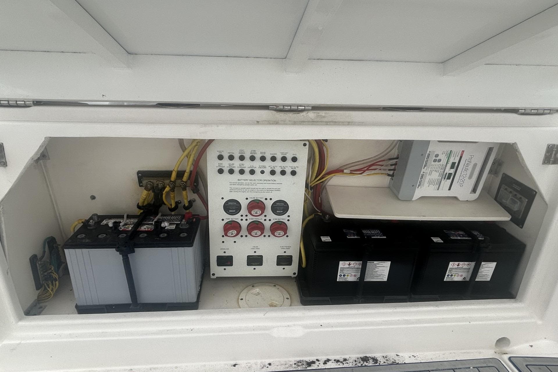 Electrical panel and batteries in a 2018 Robalo R305 Walkaround boat.