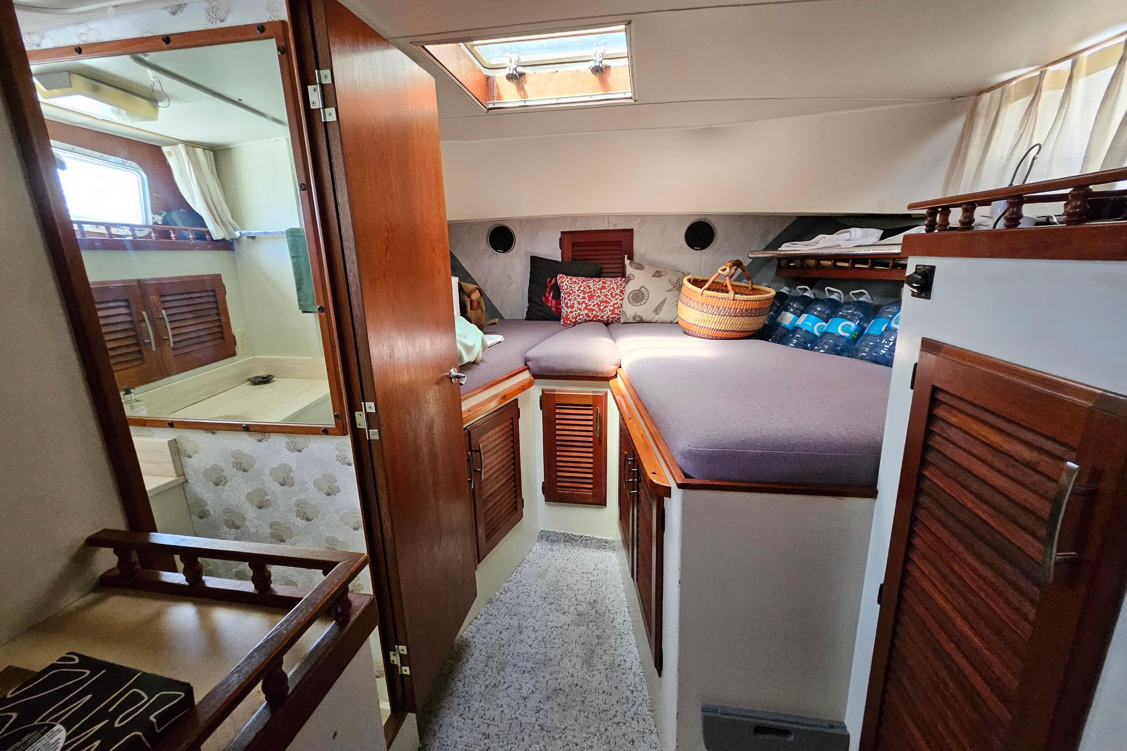 1981 Tollycraft 48 Cockpit Motor Yacht interior with cozy cabin and wooden accents.