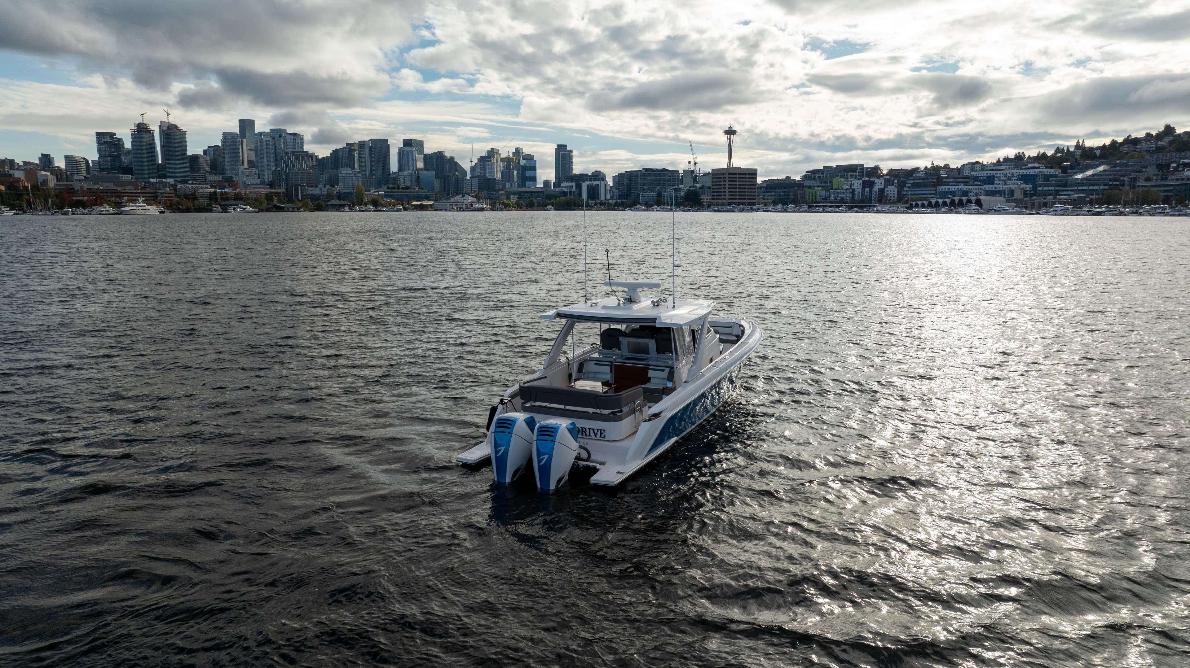 2020 Tiara Sport 38 LS boat on water with city skyline in background.