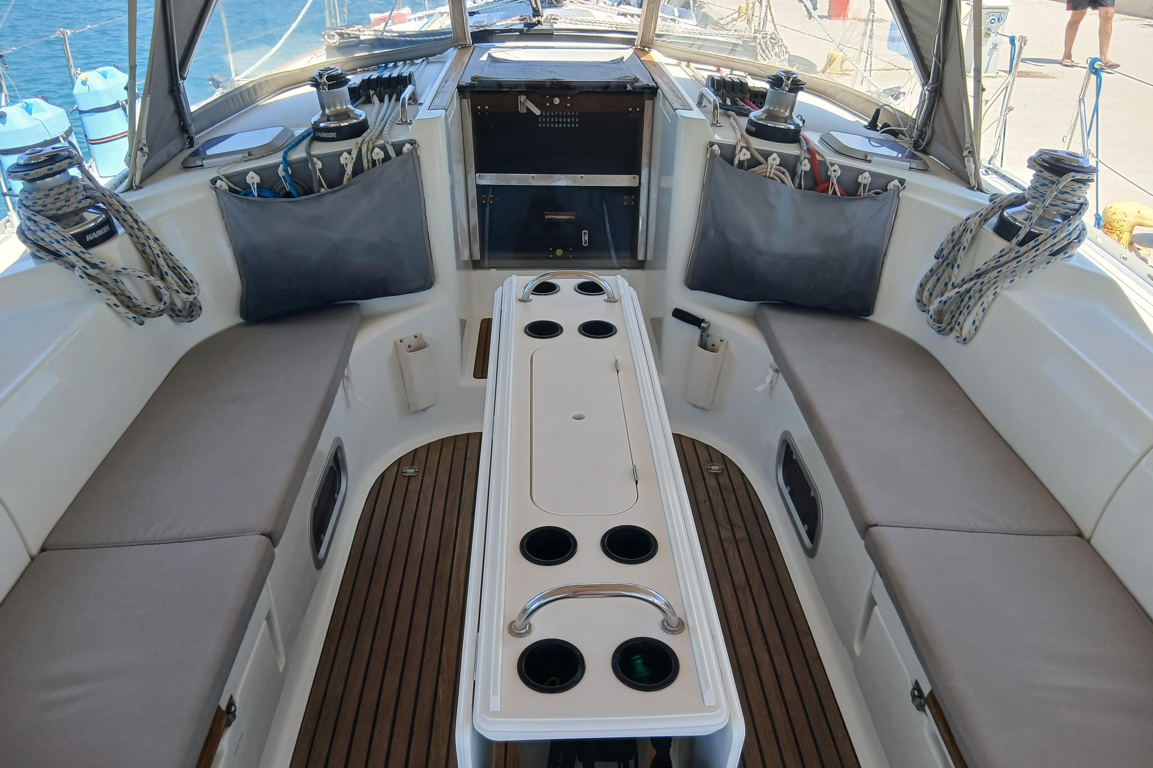 Cockpit of 2000 Jeanneau Sun Odyssey 45.2 sailboat with seating and winches.