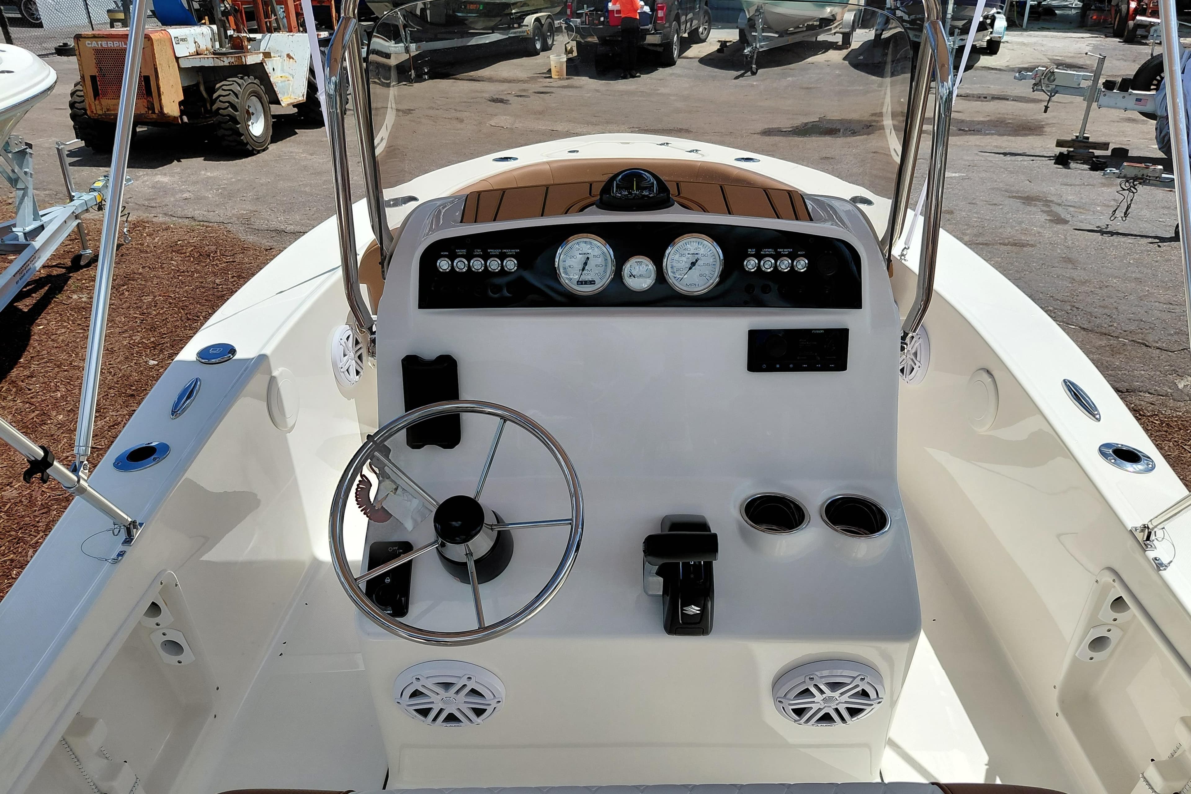 2026 Pioneer 180 Islander boat dashboard with steering wheel and gauges.