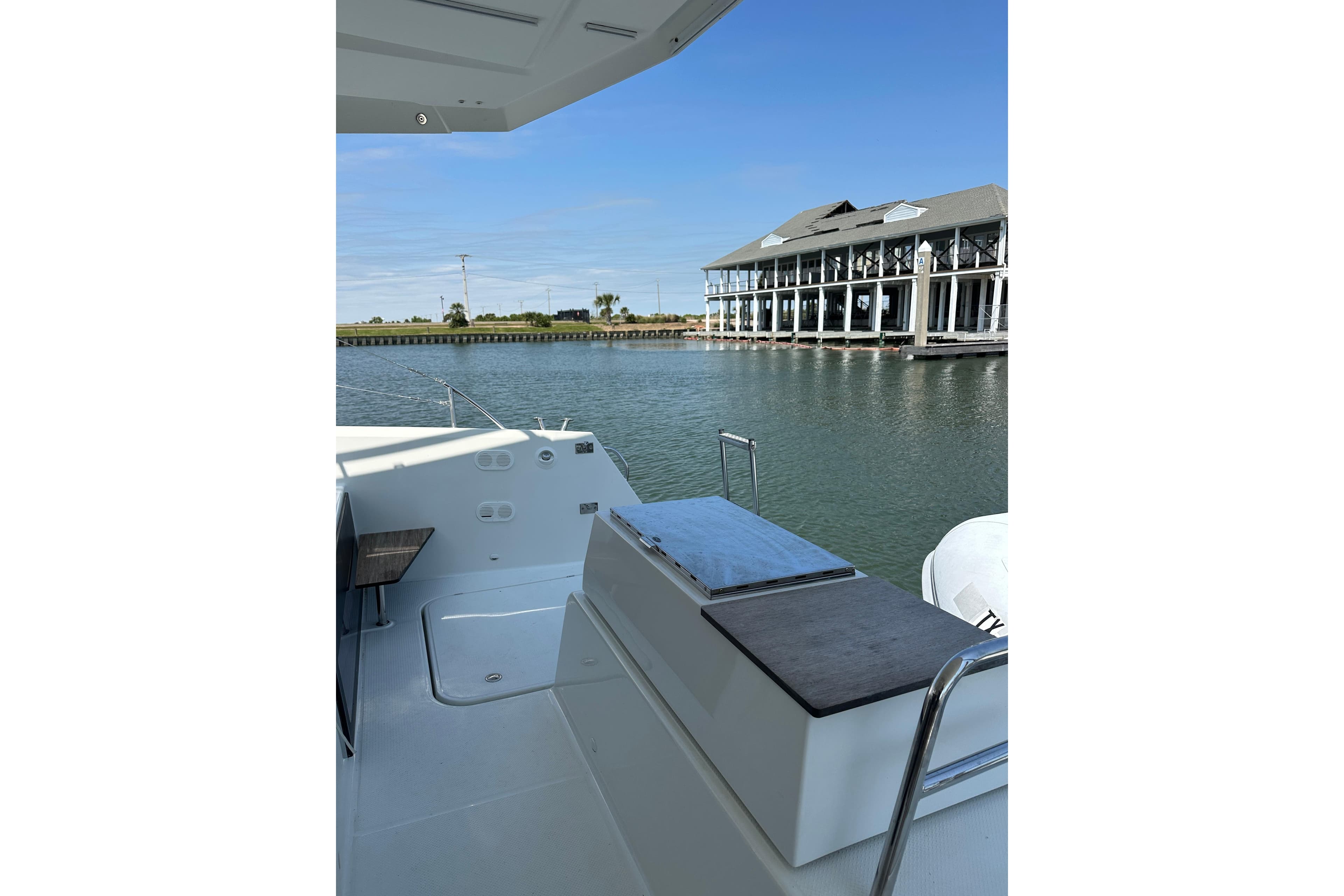 2020 Fountaine Pajot Astrea 42 Catamaran docked near waterfront building.