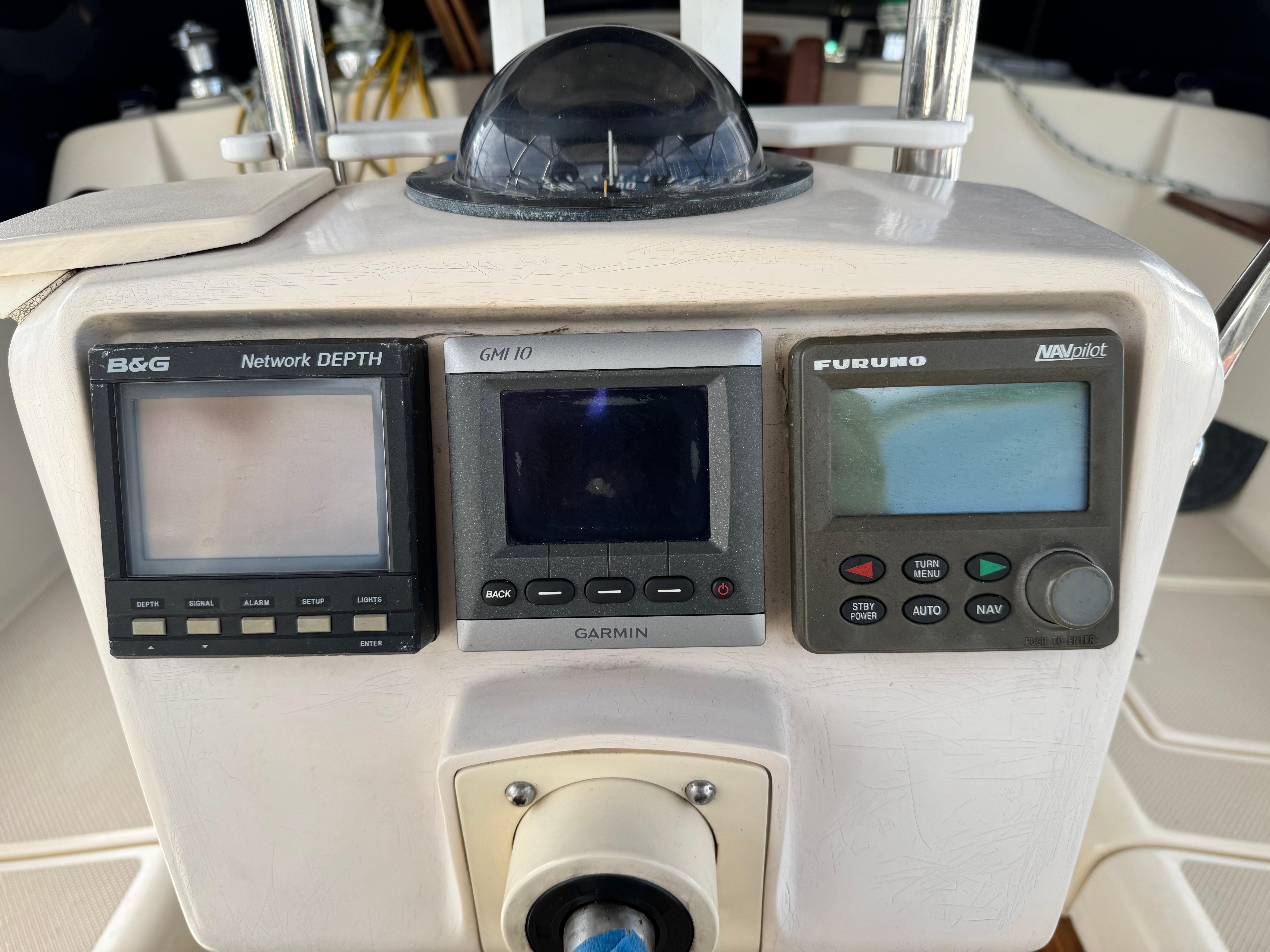 Control panel of a 1999 Island Packet 45 sailboat with navigation instruments.