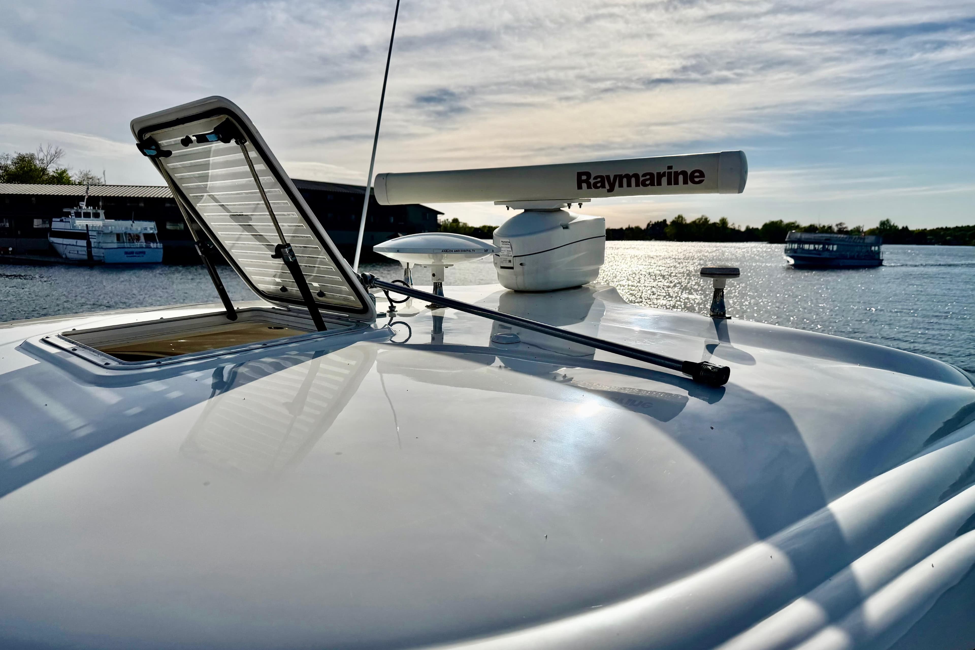 2008 Sea Ray 44 Sundancer yacht with Raymarine radar on a sunny day.