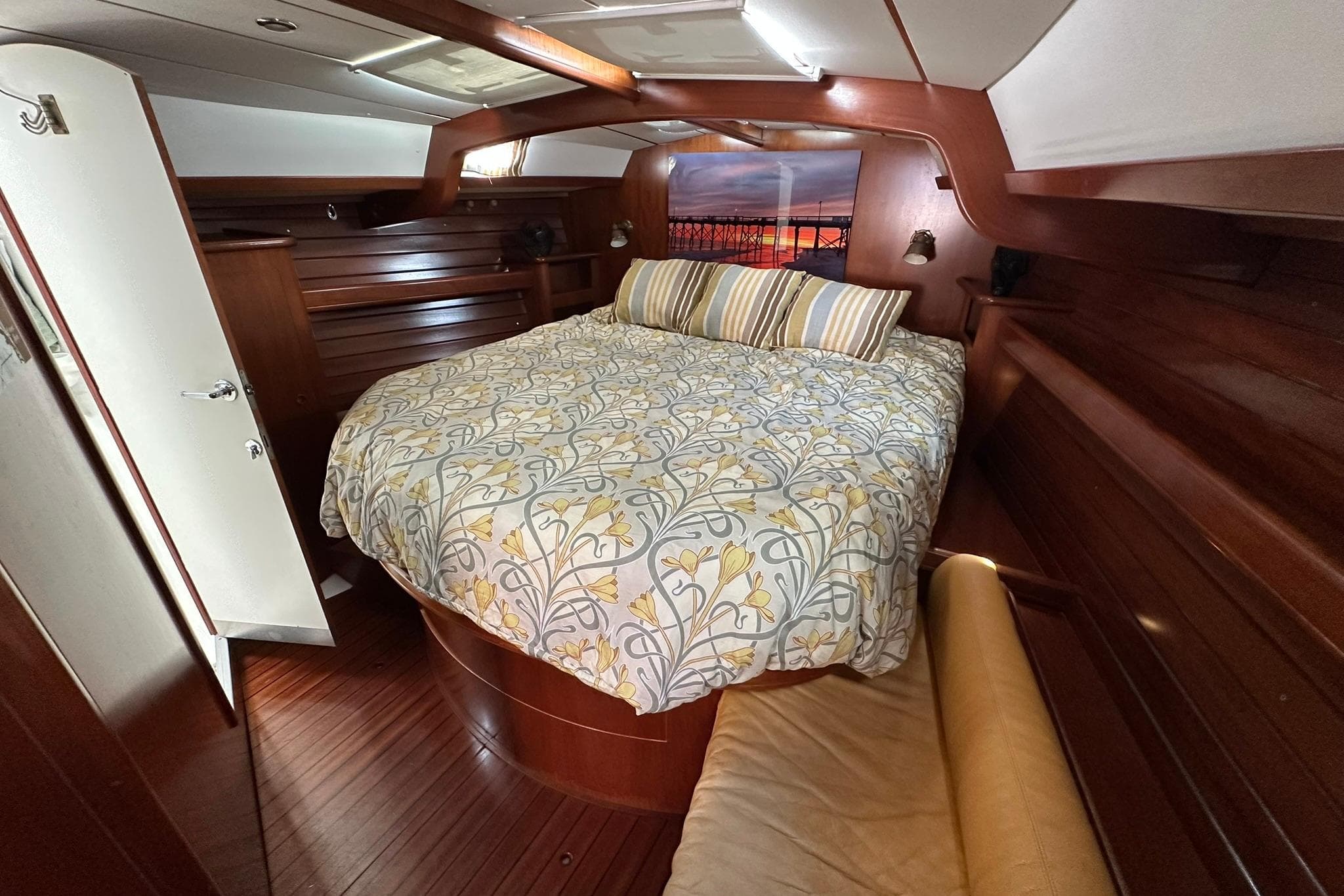 Luxurious cabin interior of a 2000 Beneteau 50 yacht with elegant wood finish.