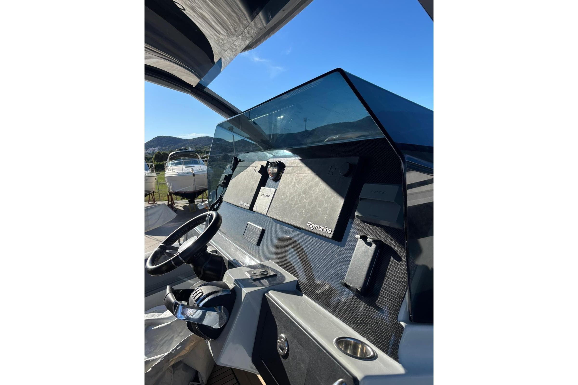 Helm of 2021 Skipper SKIPPER 42 boat with steering wheel and dashboard.