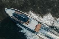 Aerial view of 2020 SACS Strider 15 yacht cruising on water.