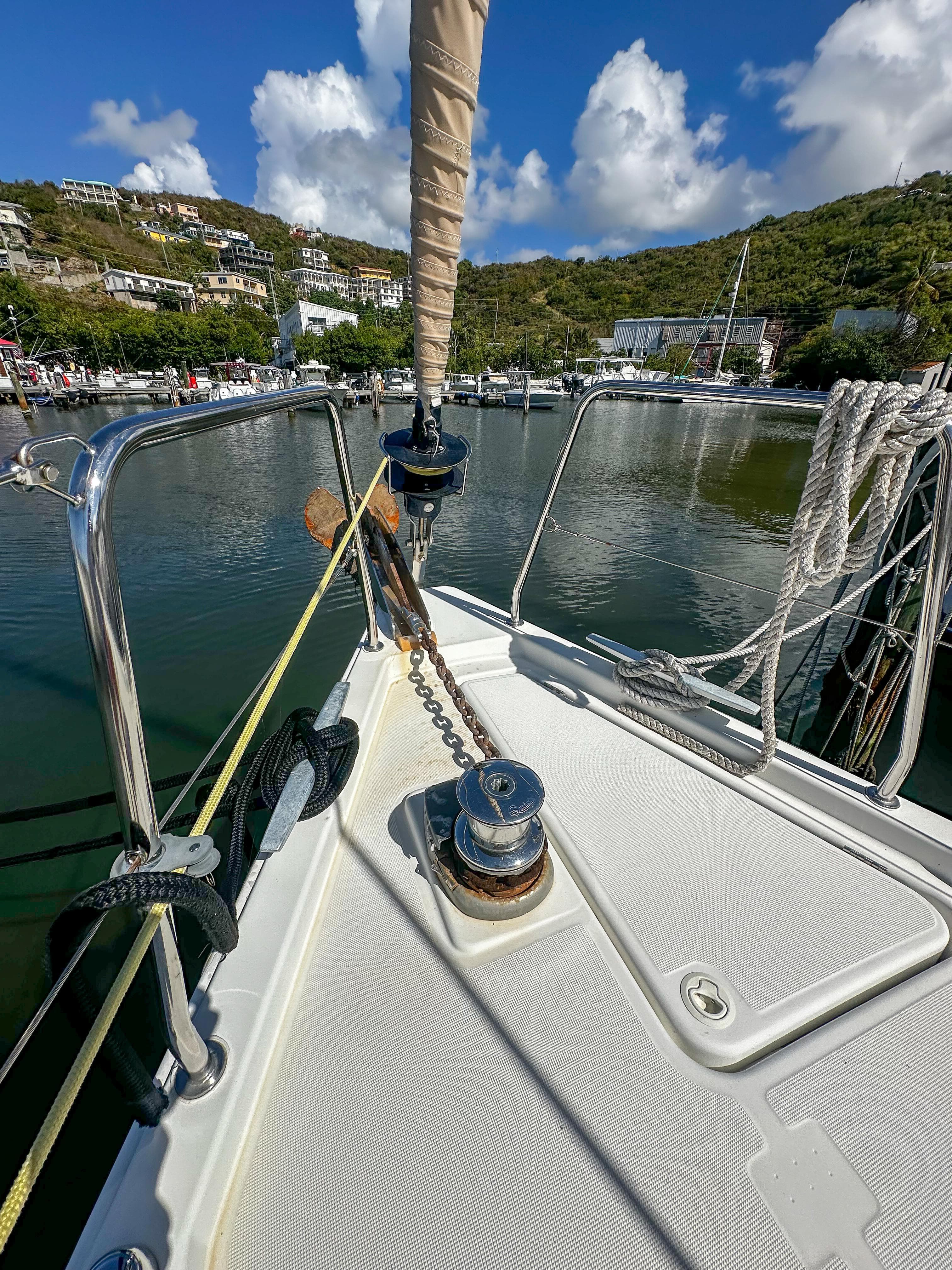 Beneteau Oceanis 41.1 sailboat deck, 2018 model, docked in a scenic marina.