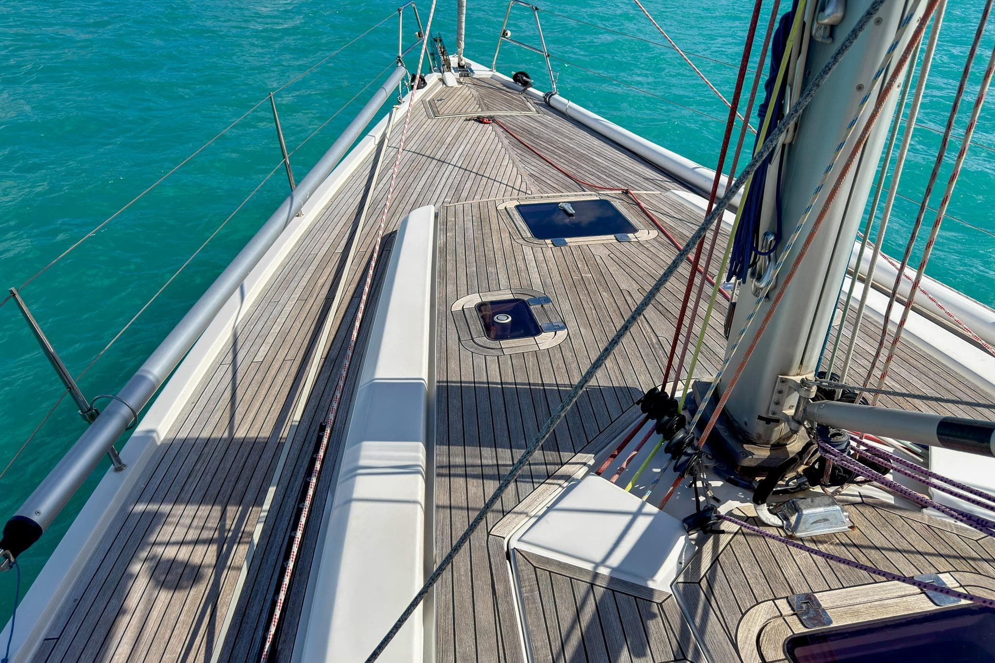 Deck view of 2010 Grand Soleil 46 sailboat on turquoise water.