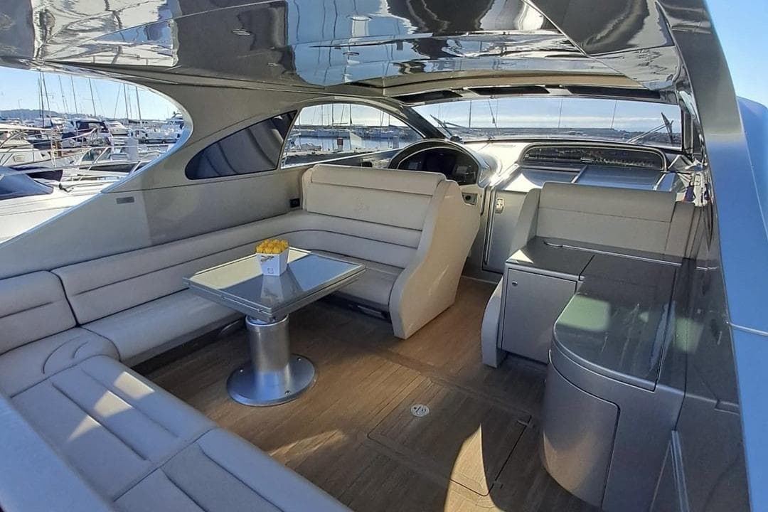 Luxurious interior of a 2010 Otam 58 yacht with elegant seating and modern design.