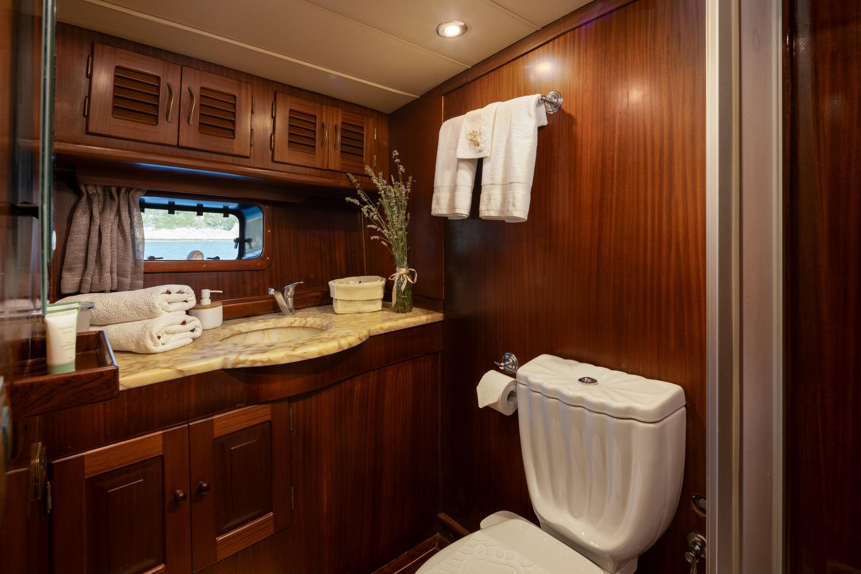 Luxurious wooden bathroom interior on a 2000 Custom GULET yacht.