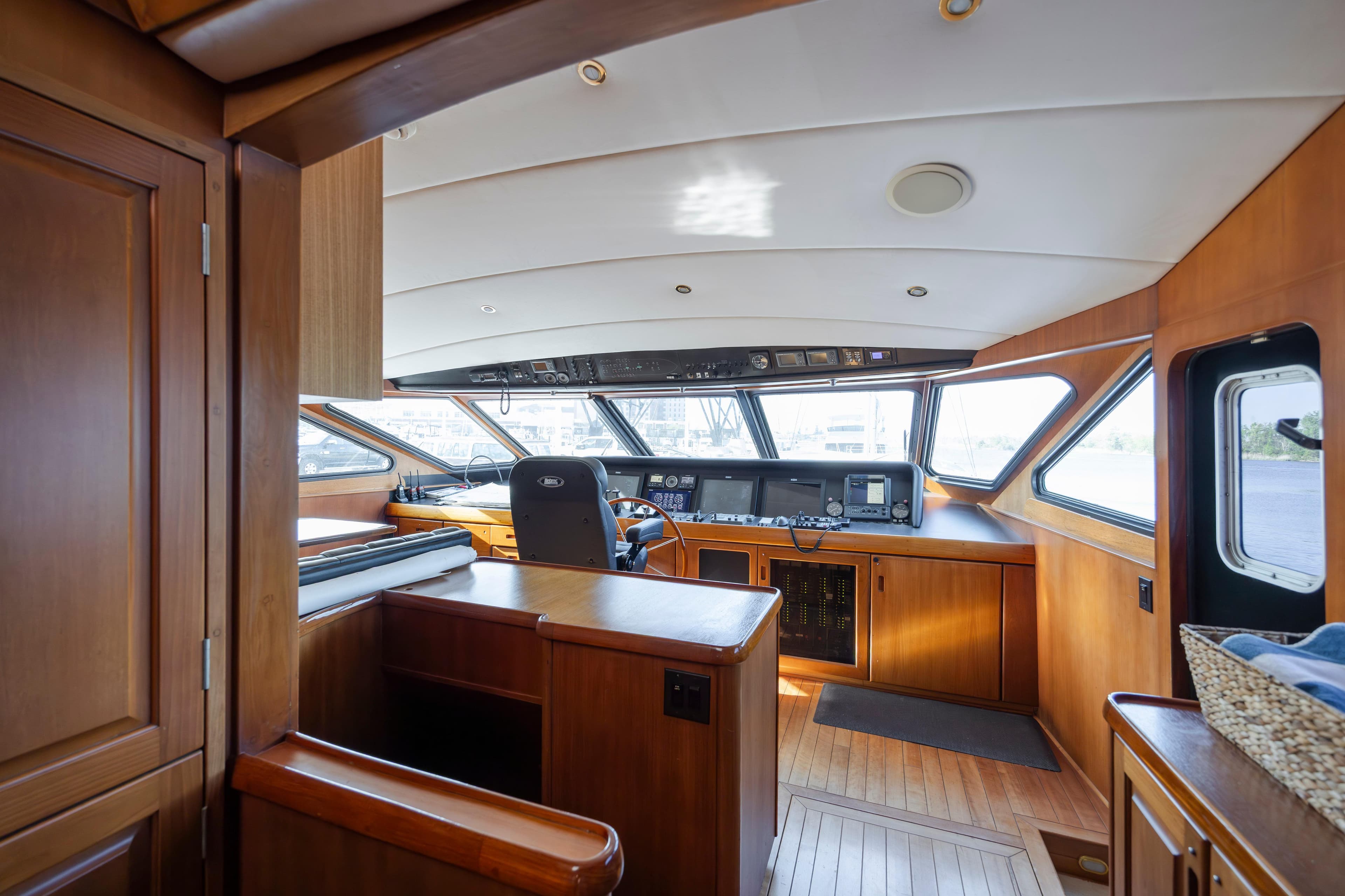 Interior of a 1988 Christensen Custom yacht with wood paneling and helm area.