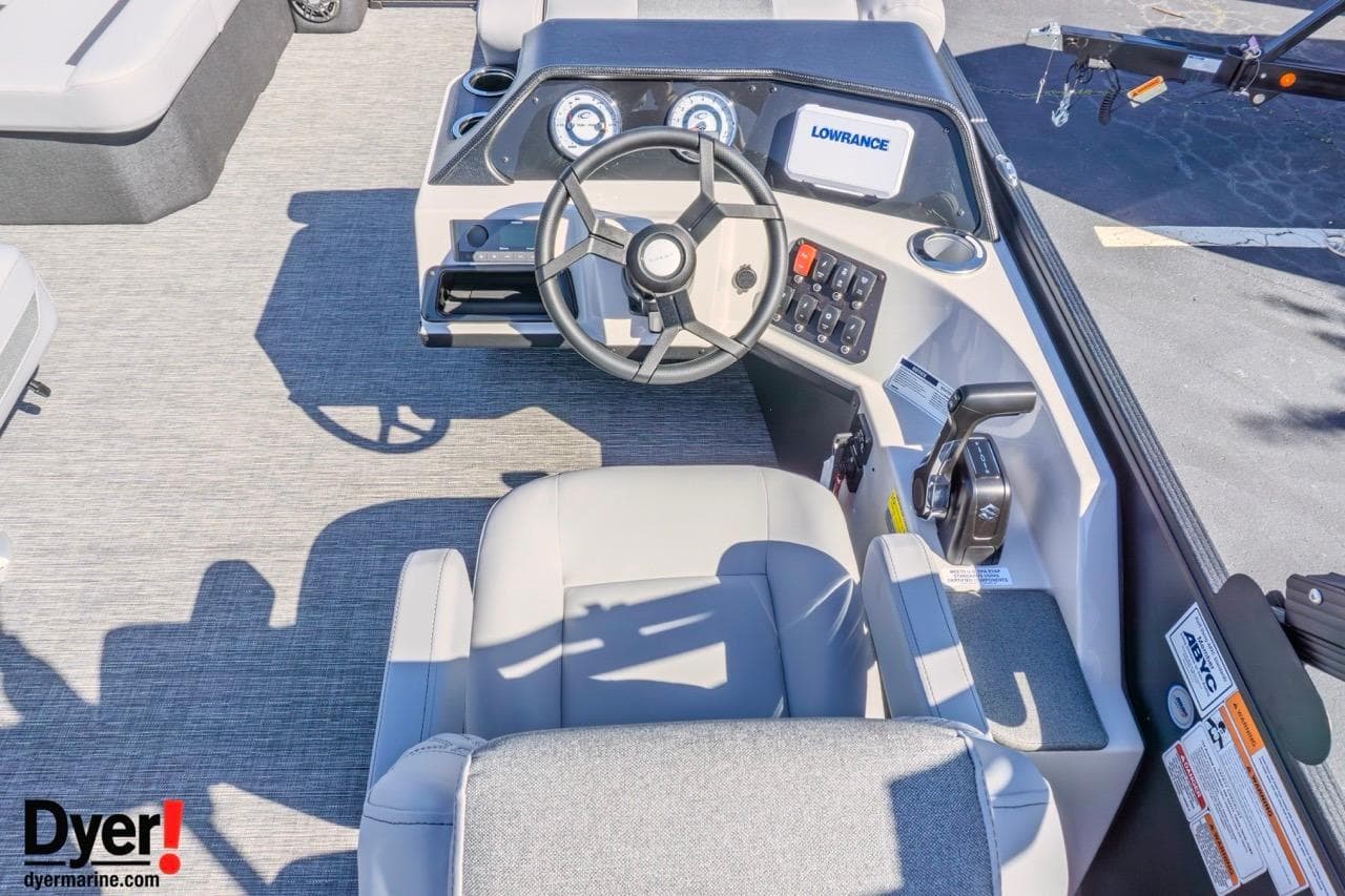 2026 Crest Conquest 210 SLC boat dashboard with steering wheel and control panel.