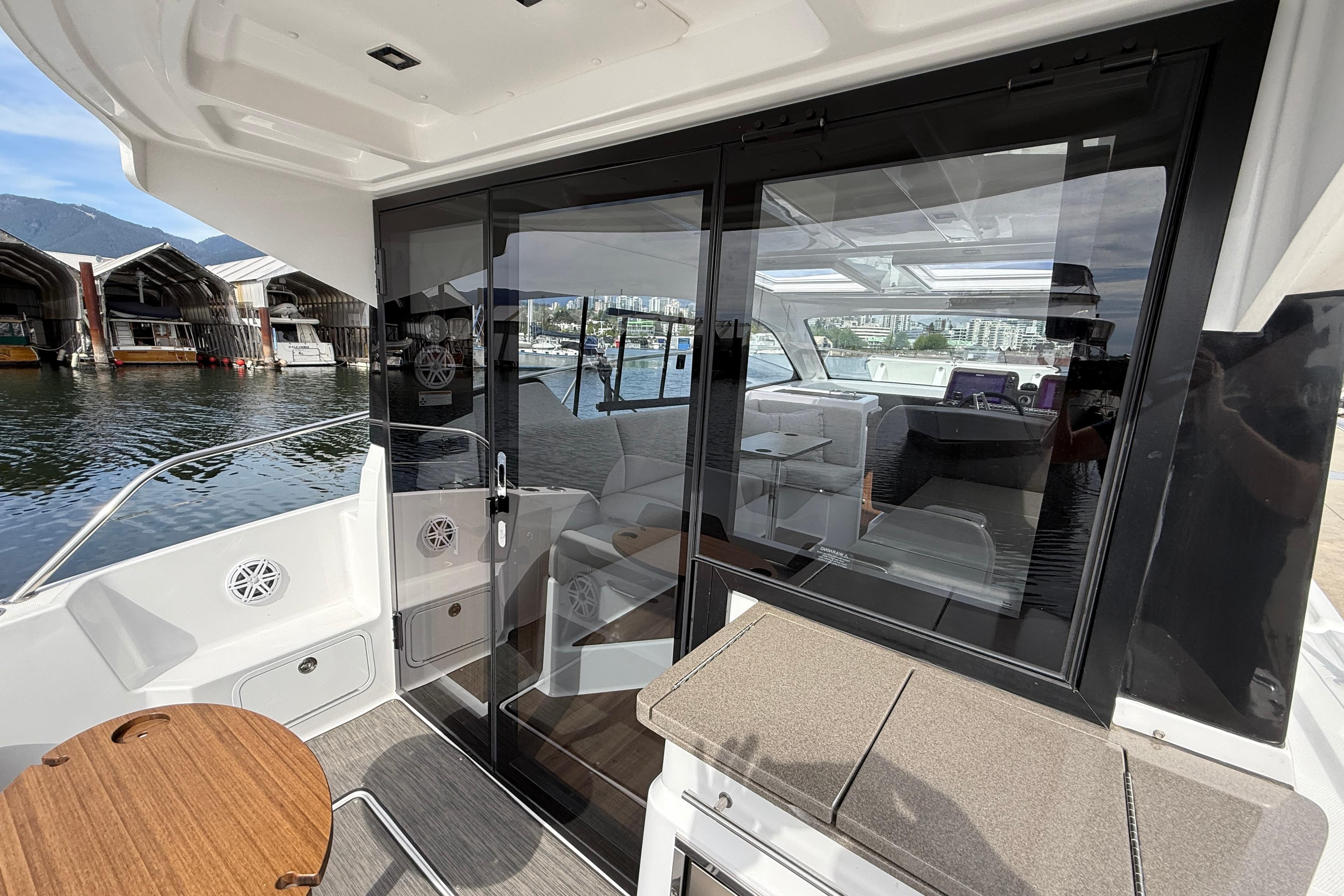 2022 Four Winns V355 Coupe OB yacht interior with marina view.