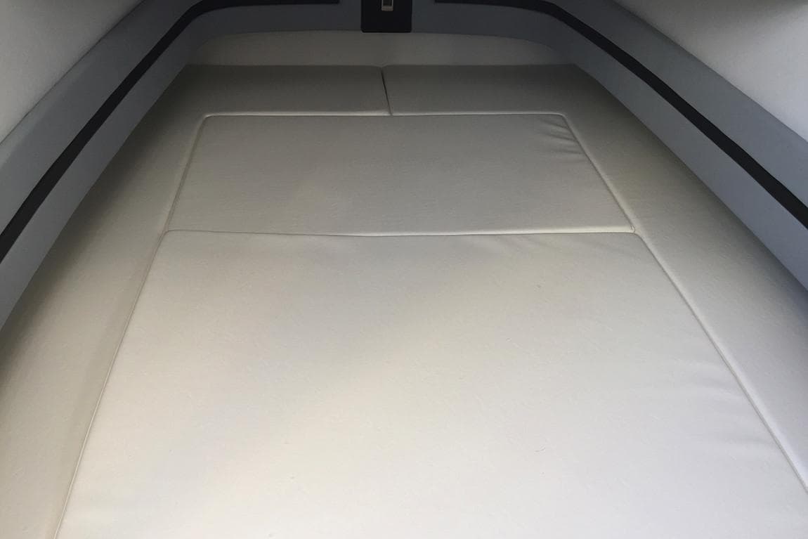 Manufacturer Provided Image: Interior cabin of 2021 Mystic Powerboats M3800 with cushioned seating.