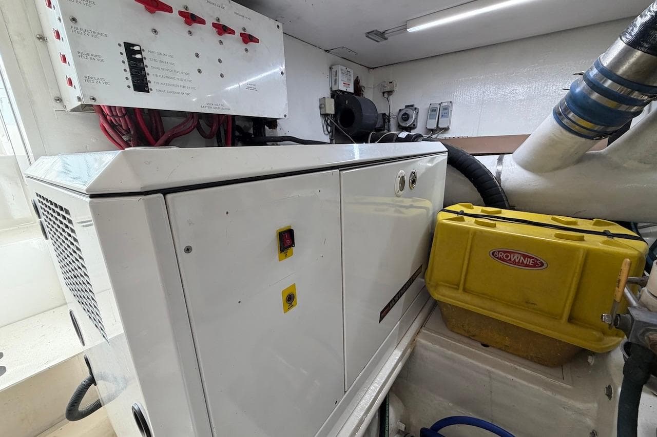 Engine room of 1999 Viking 58 Convertible with electrical panel and equipment.