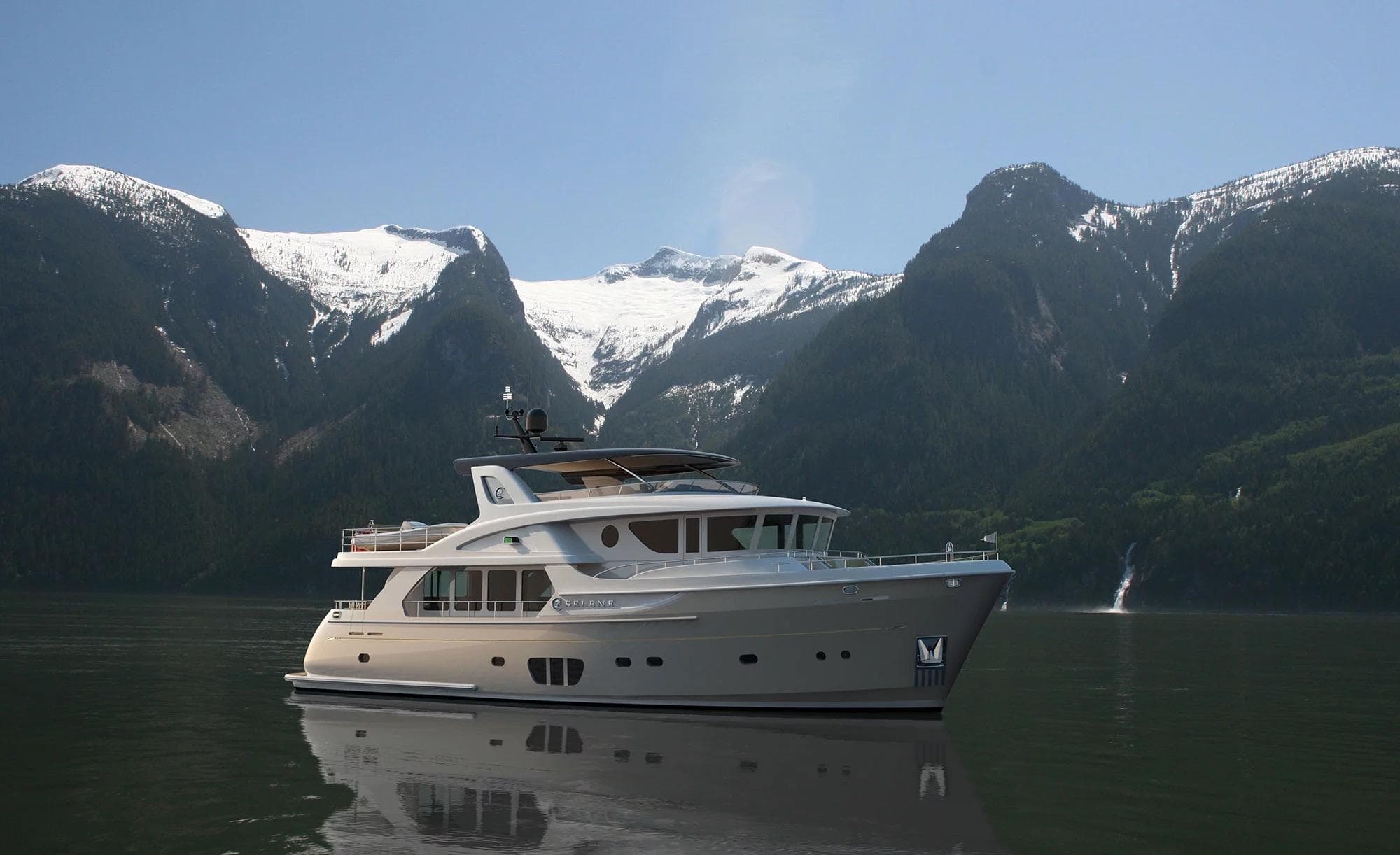 2026 Selene 78 Ocean Explorer yacht cruising near snow-capped mountains.