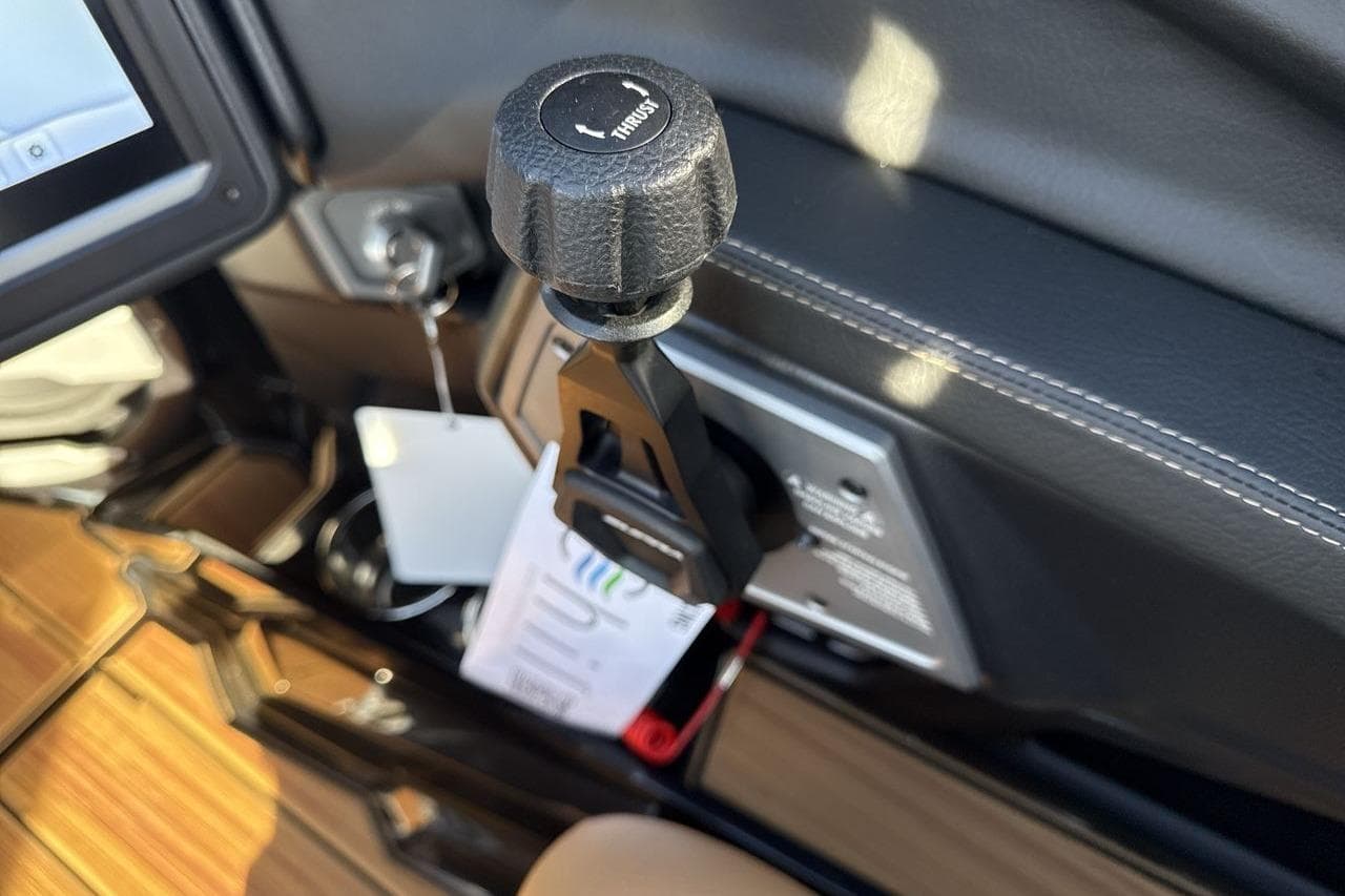 Control lever in 2026 Supra SE 550 boat cockpit, featuring sleek design and modern technology.