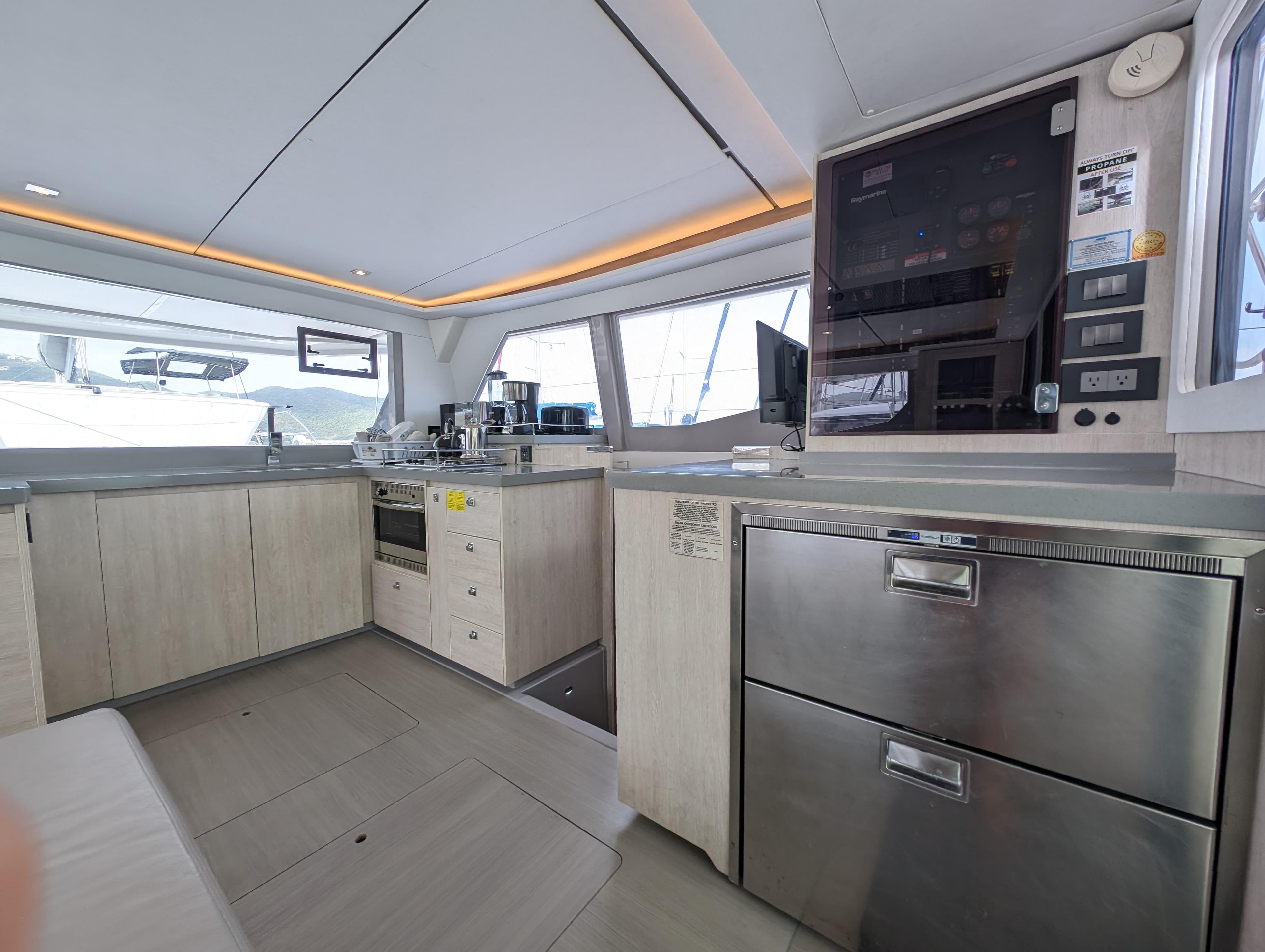 Modern kitchen interior on a 2020 Leopard 45 yacht, featuring sleek cabinetry and appliances.
