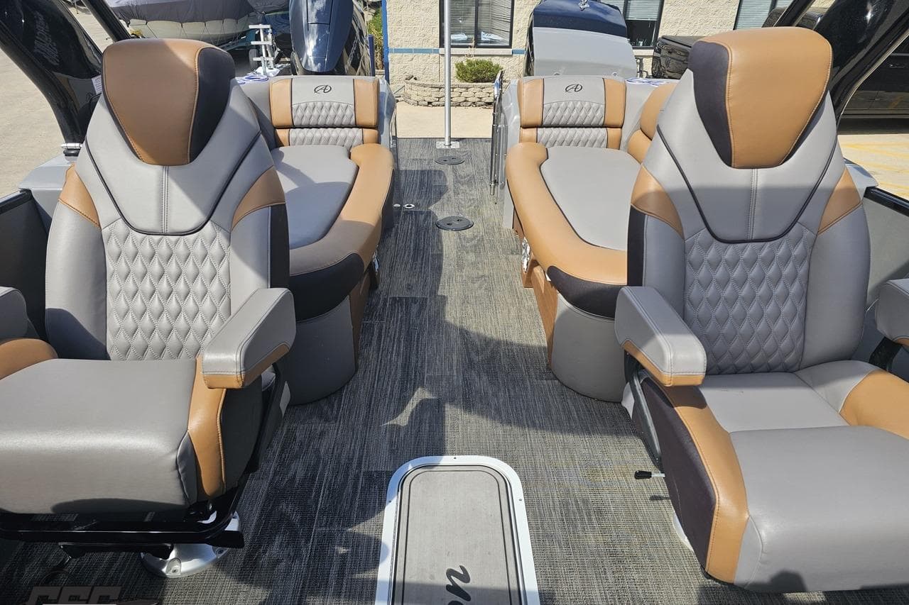 2024 Avalon Excalibur Quad Lounge Windshield boat interior with luxurious seating.