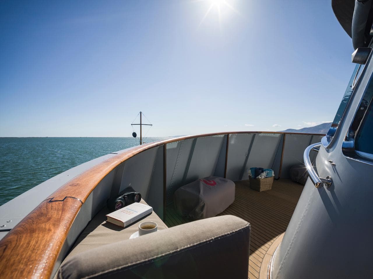 Deck of 1962 Laurent Giles TSDMY motor yacht under sunny sky.