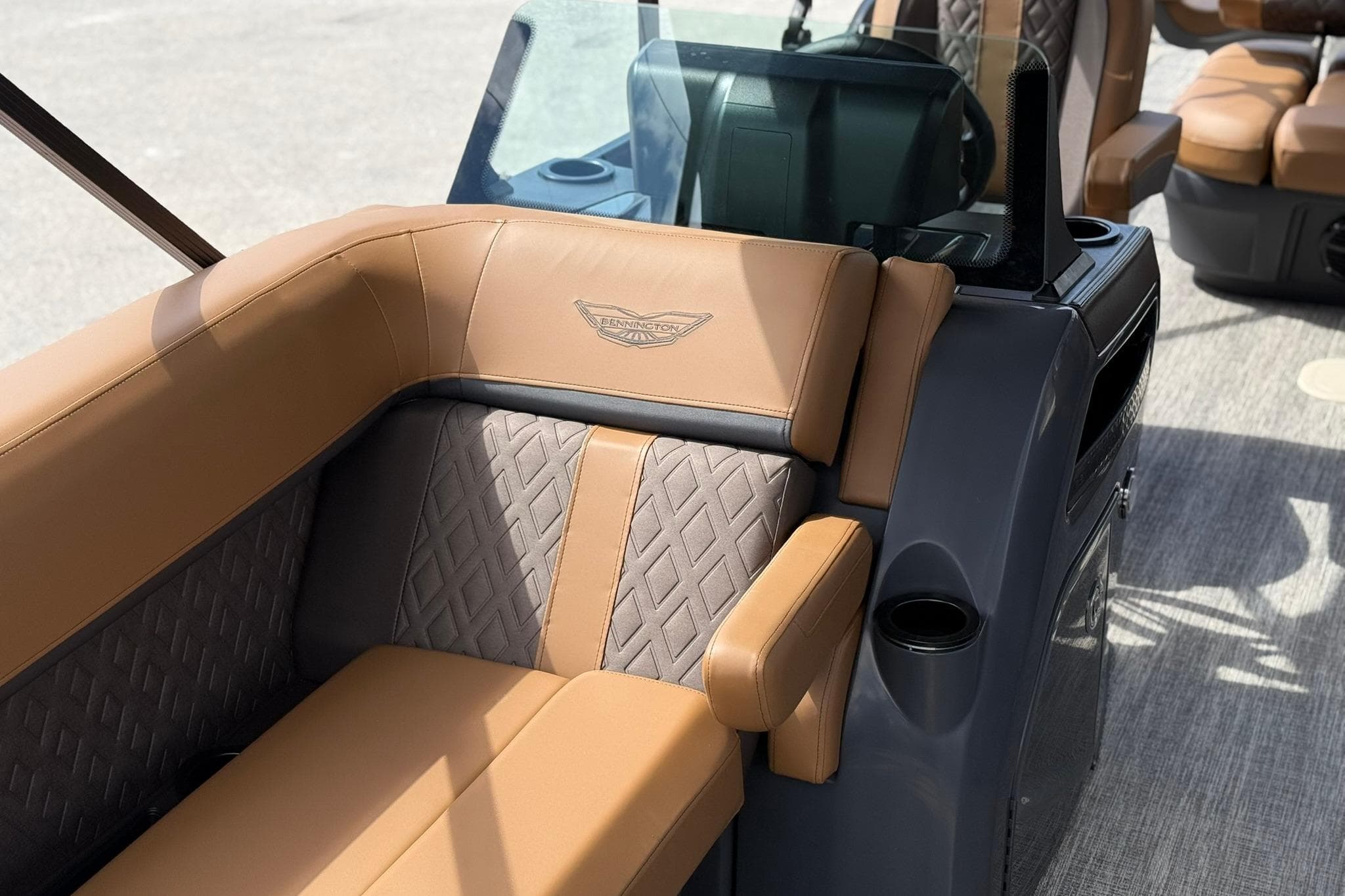 Luxurious seating on the 2026 Bennington 24 M Fish and Cruise boat, featuring elegant upholstery.