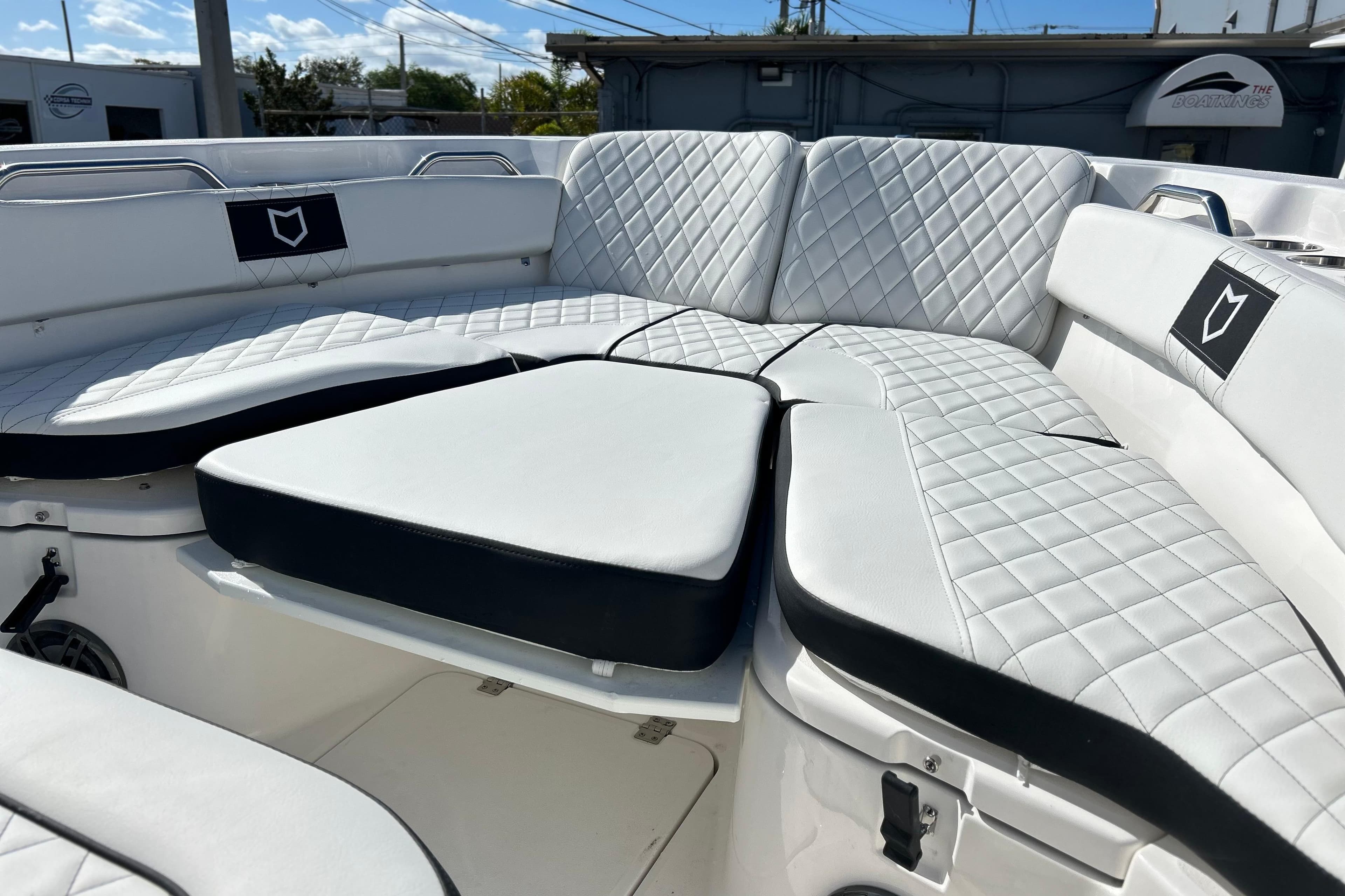 2026 Sea Fox 228 Commander boat with luxurious white quilted seating.