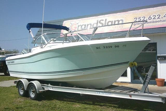 2006 Clearwater 2200 Dual Console boat on trailer outside dealership.