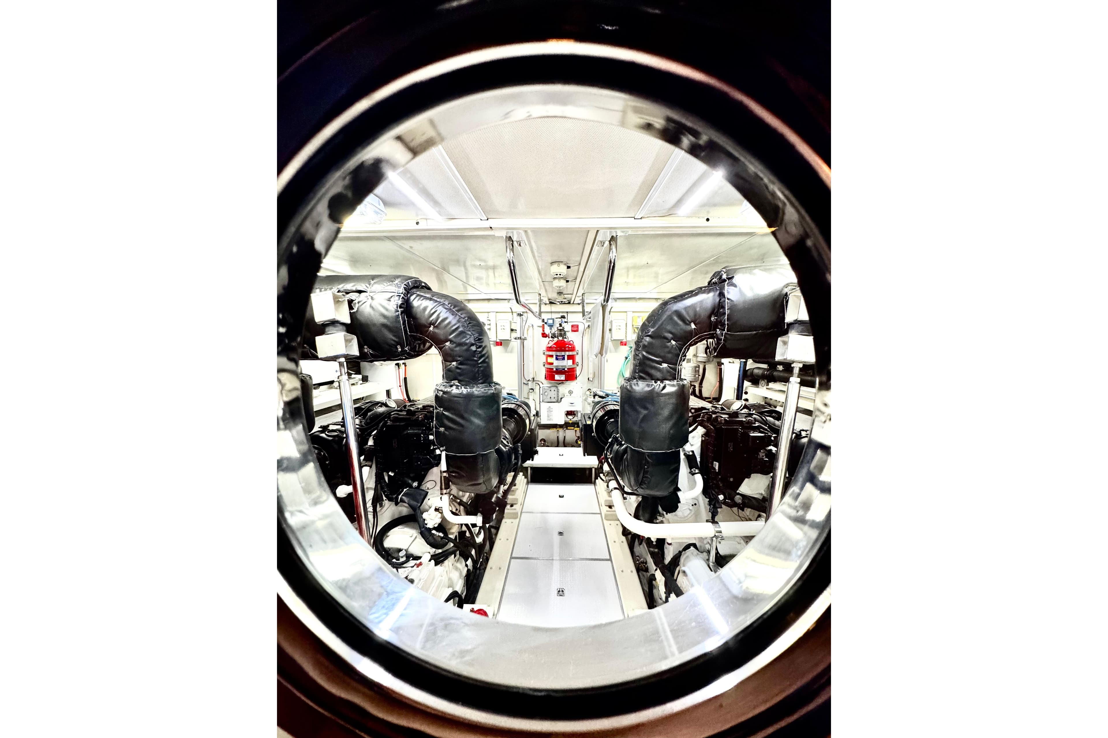 Engine room of 2011 Horizon E88 yacht, featuring advanced machinery and equipment.