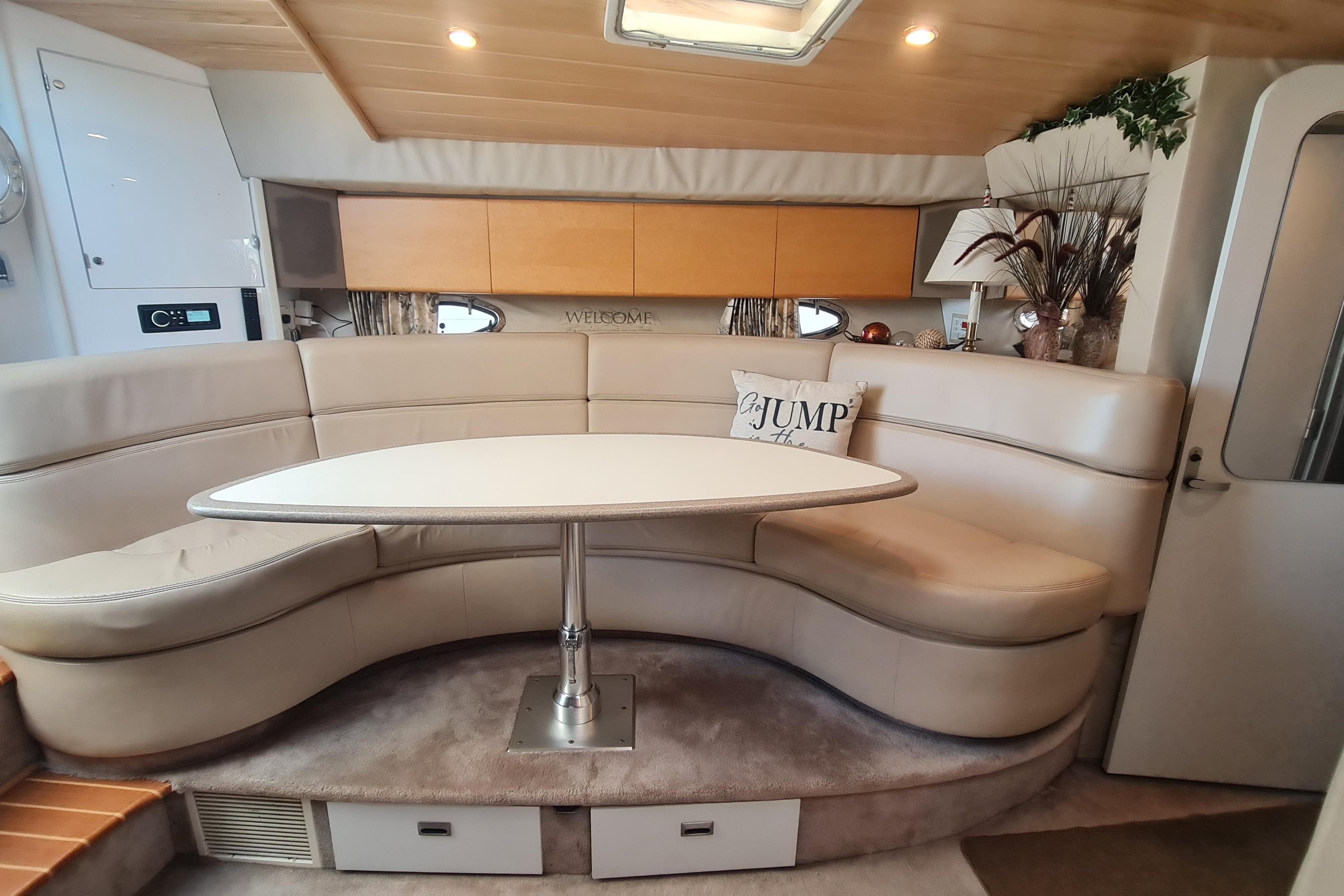 1998 Formula 41 Performance Cruiser interior with curved seating and table.