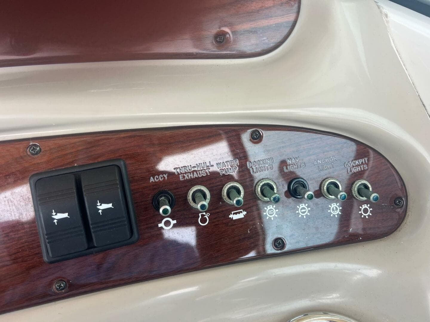 Control panel of a 2007 Sea Ray 240 Sundeck boat with labeled switches.
