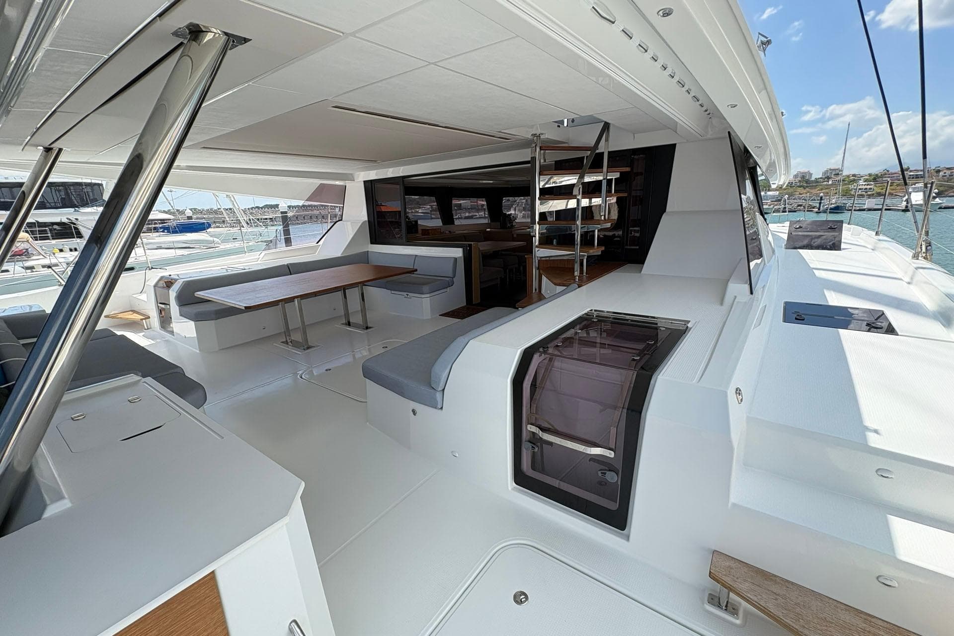 Luxurious 2025 Fountaine Pajot Samana 59 yacht interior with spacious seating and dining area.