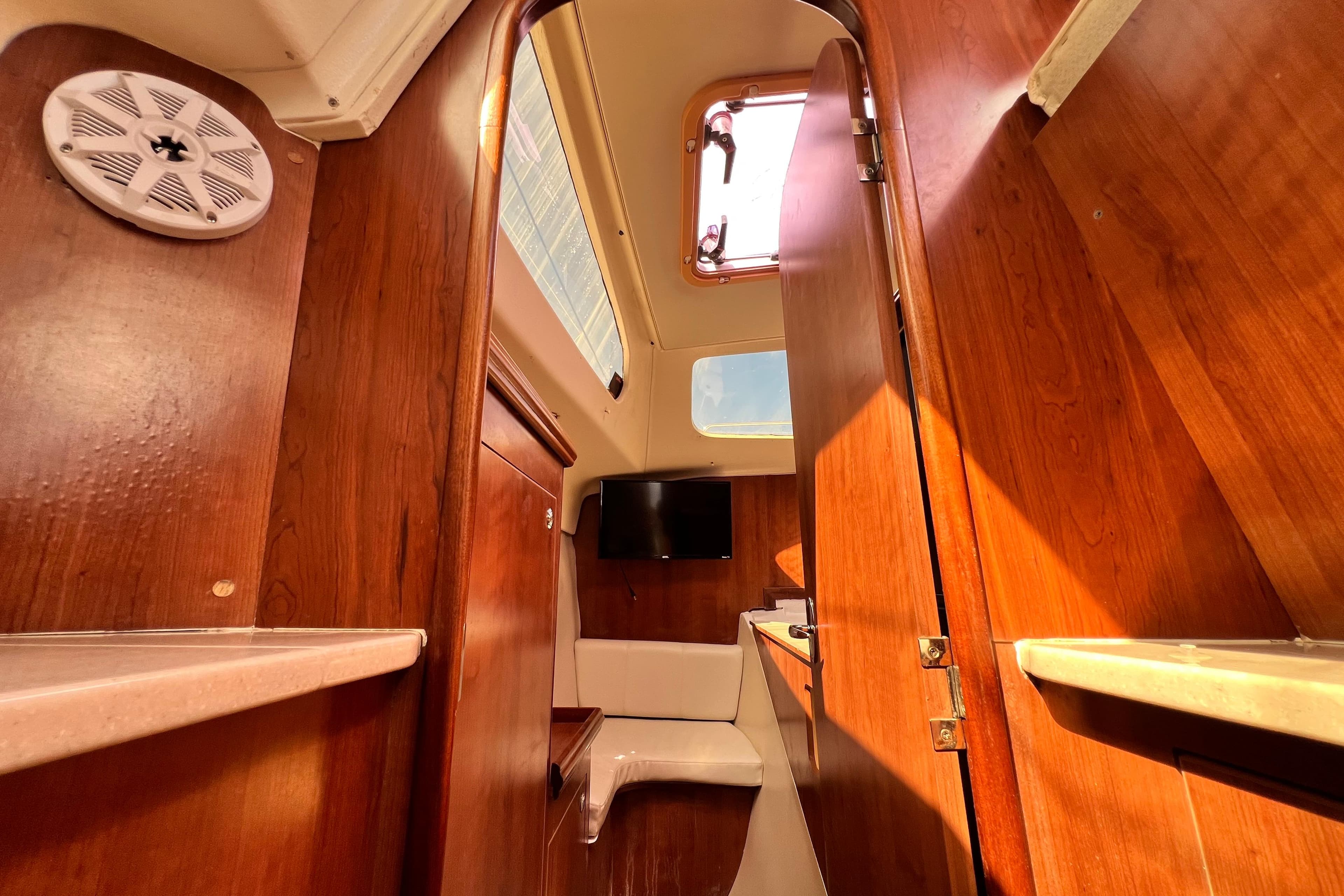 Interior of 2013 Gemini Legacy 35 sailboat with wood finish and natural light.