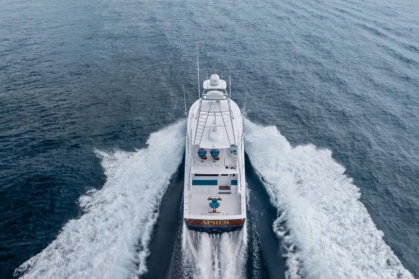 Aerial view of 2005 Viking 61 Convertible yacht cruising on open water.