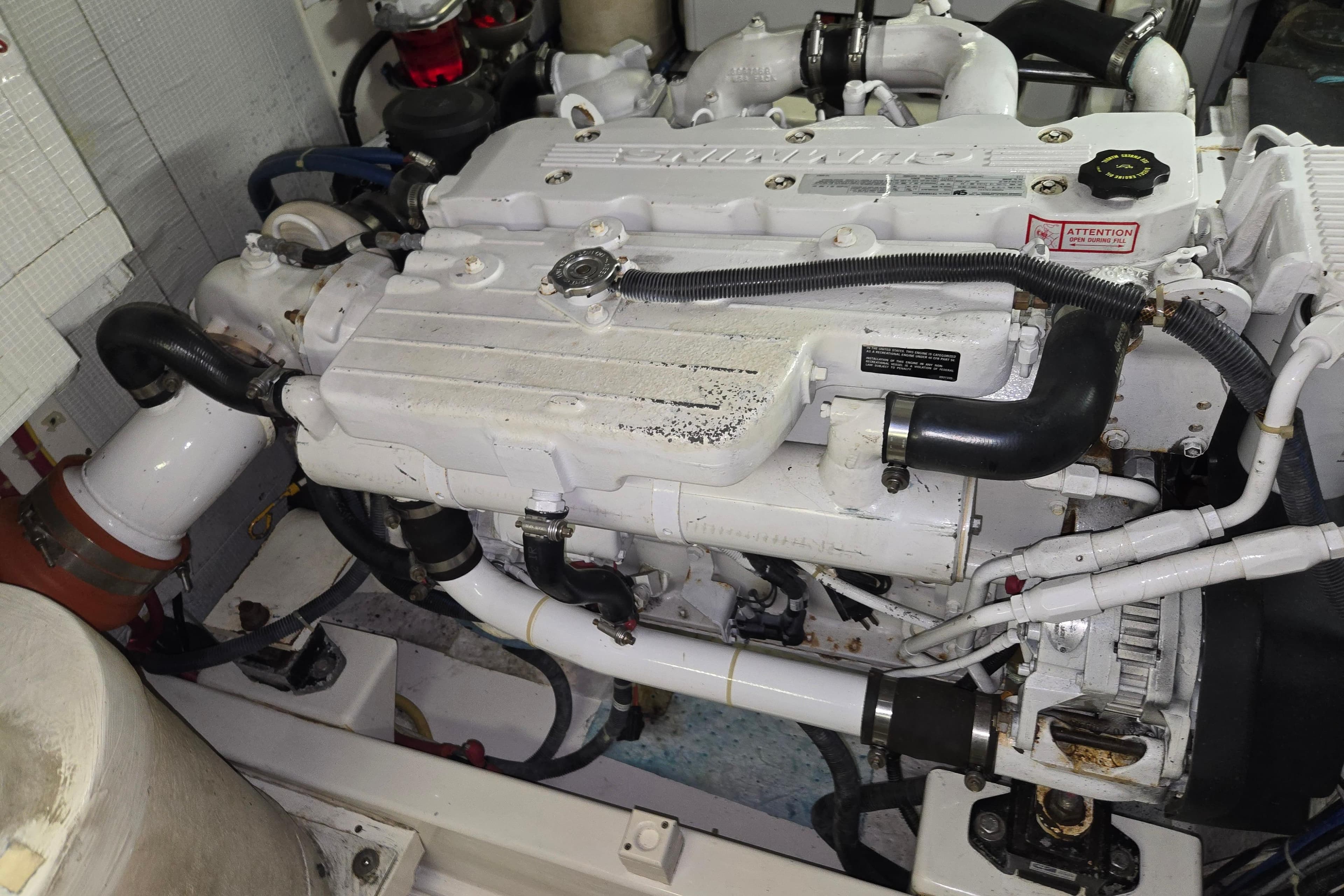 Engine compartment of a 2012 American Tug 365 Flybridge boat, showcasing mechanical components.