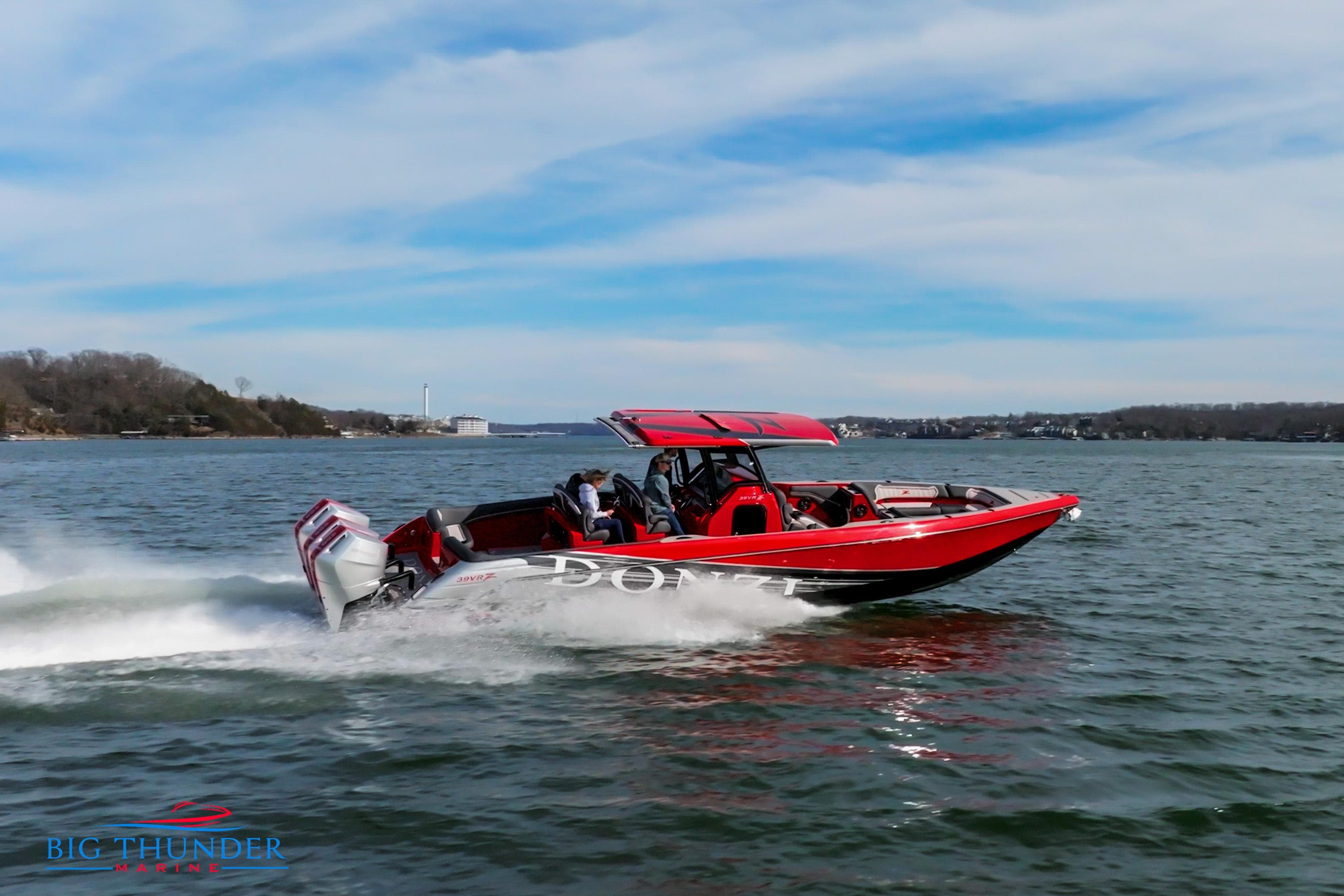 2024 Donzi 39 VRZ speedboat cruising on a lake.